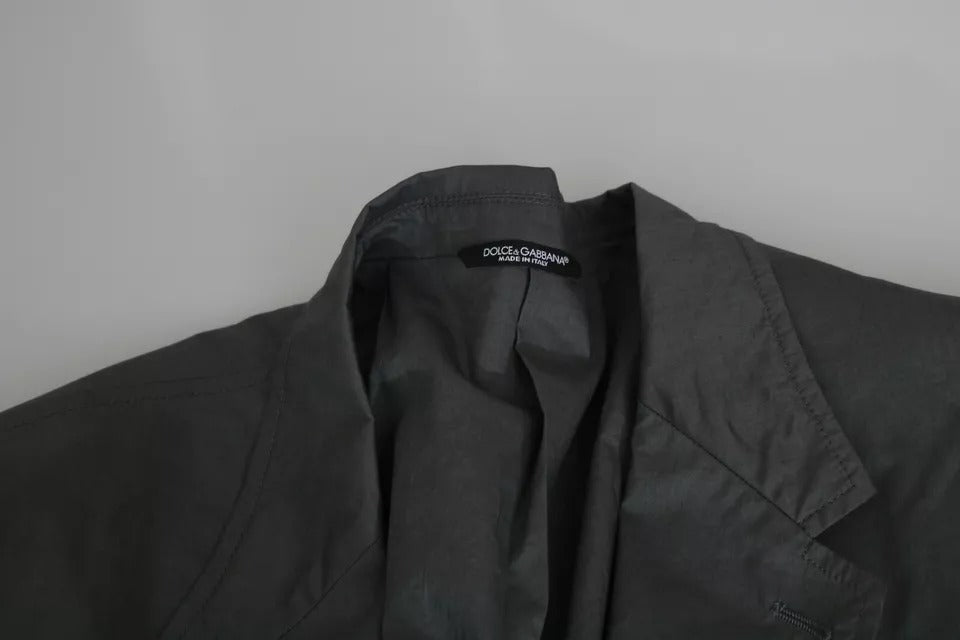 Elevate your wardrobe with the Dolce & Gabbana Gray Cotton Single Breasted Formal Blazer, a masterpiece of Italian craftsmanship that embodies timeless elegance and sophistication.