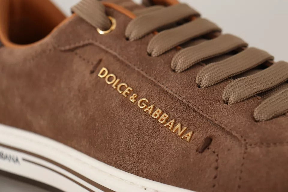 Elevate your style with Dolce & Gabbana's Brown Suede Logo Low Top Sneakers, where exquisite craftsmanship meets timeless luxury for the discerning individual.