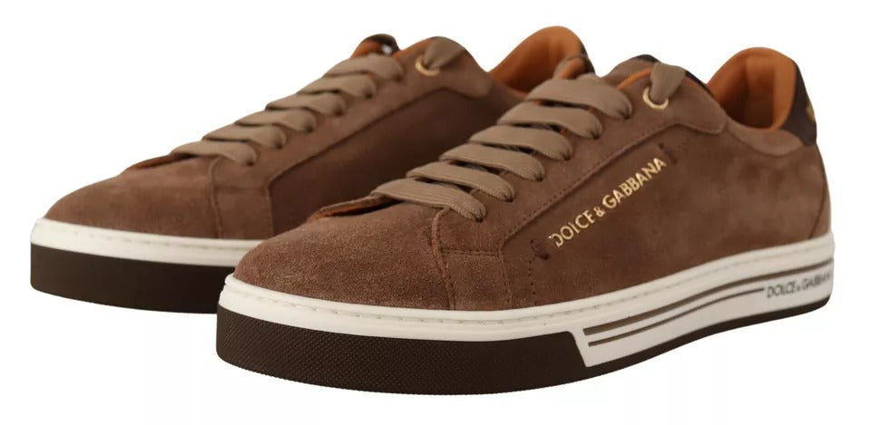 Experience the exquisite allure of Dolce & Gabbana's Brown Suede Logo Low Top Sneakers, where sumptuous craftsmanship meets timeless elegance for the discerning individual.