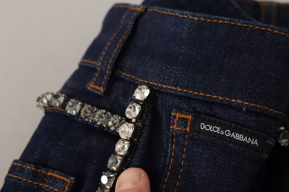 Elevate your summer wardrobe with Dolce & Gabbana's Dark Blue Embellished Denim Hot Pants, where exquisite Italian craftsmanship meets luxurious allure for the discerning individual.