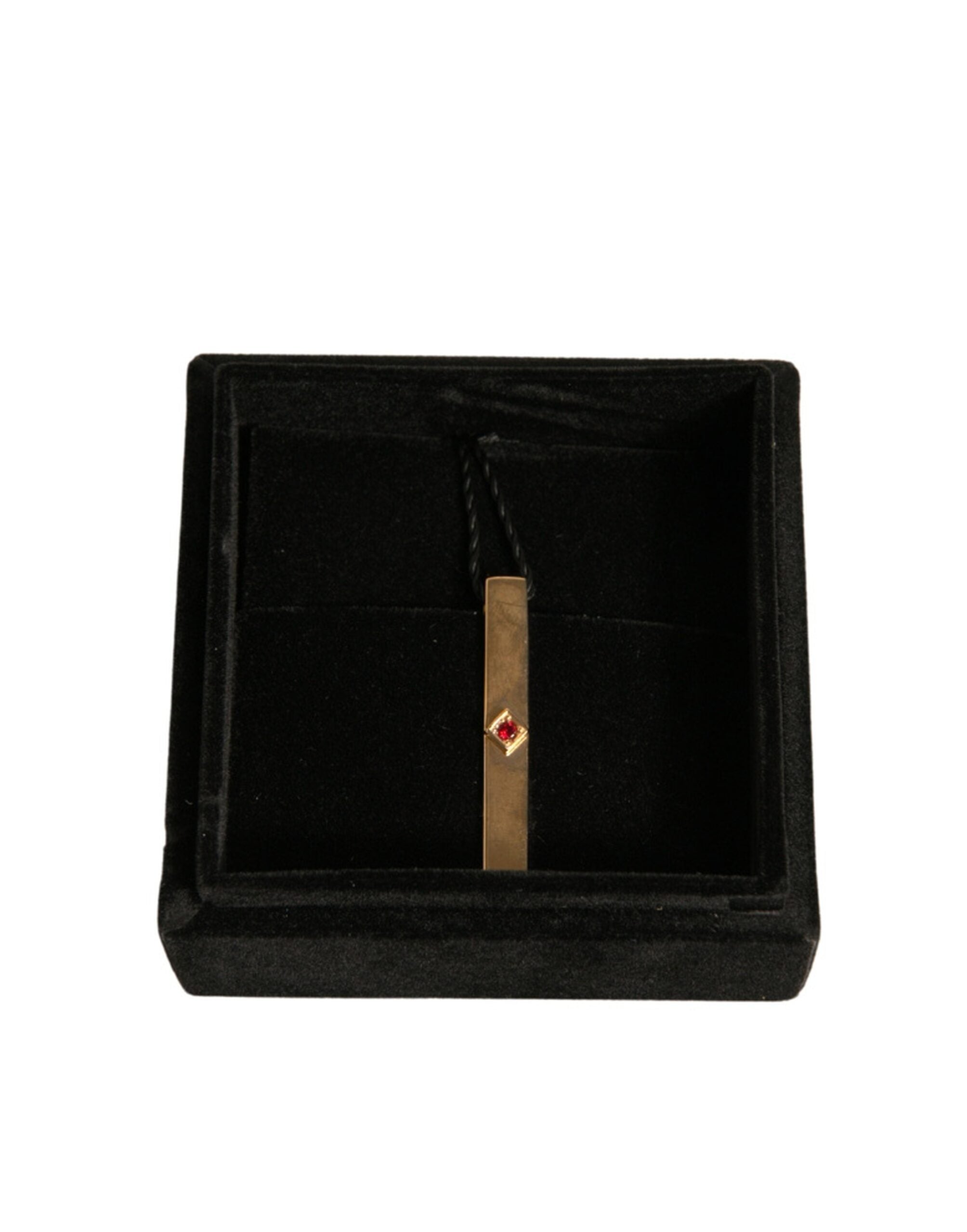 Elevate your style with the Dolce & Gabbana Gold Tone Brass Crystal Tie Clip Bar, a masterpiece of Italian craftsmanship that embodies timeless elegance and sophistication.