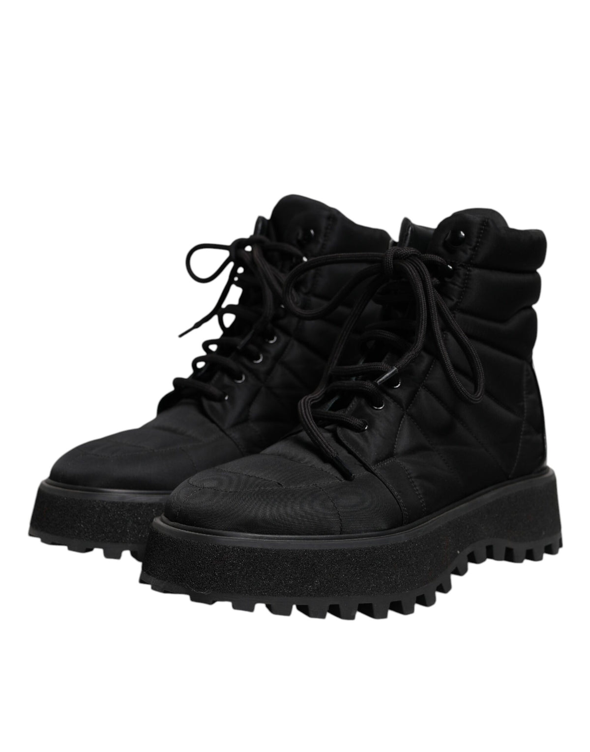 Experience the exquisite Dolce & Gabbana Black Padded Mid Calf Lace Up Boots, where luxurious craftsmanship meets timeless elegance, perfect for the discerning individual.