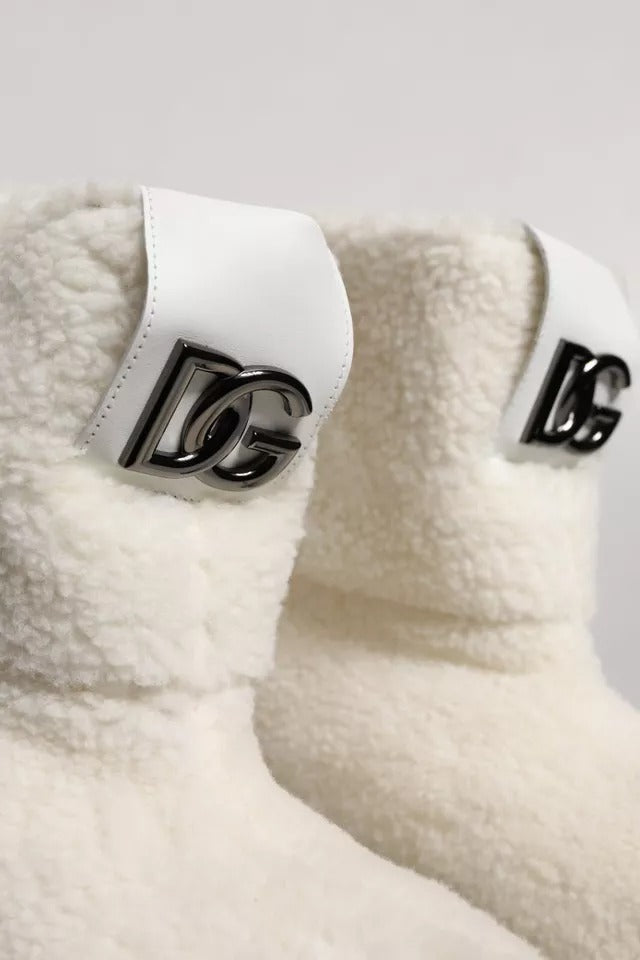 Indulge in the exquisite Dolce & Gabbana White Plush Logo Padded Mid Calf Boots, where luxurious craftsmanship meets timeless elegance, perfect for any sophisticated occasion.