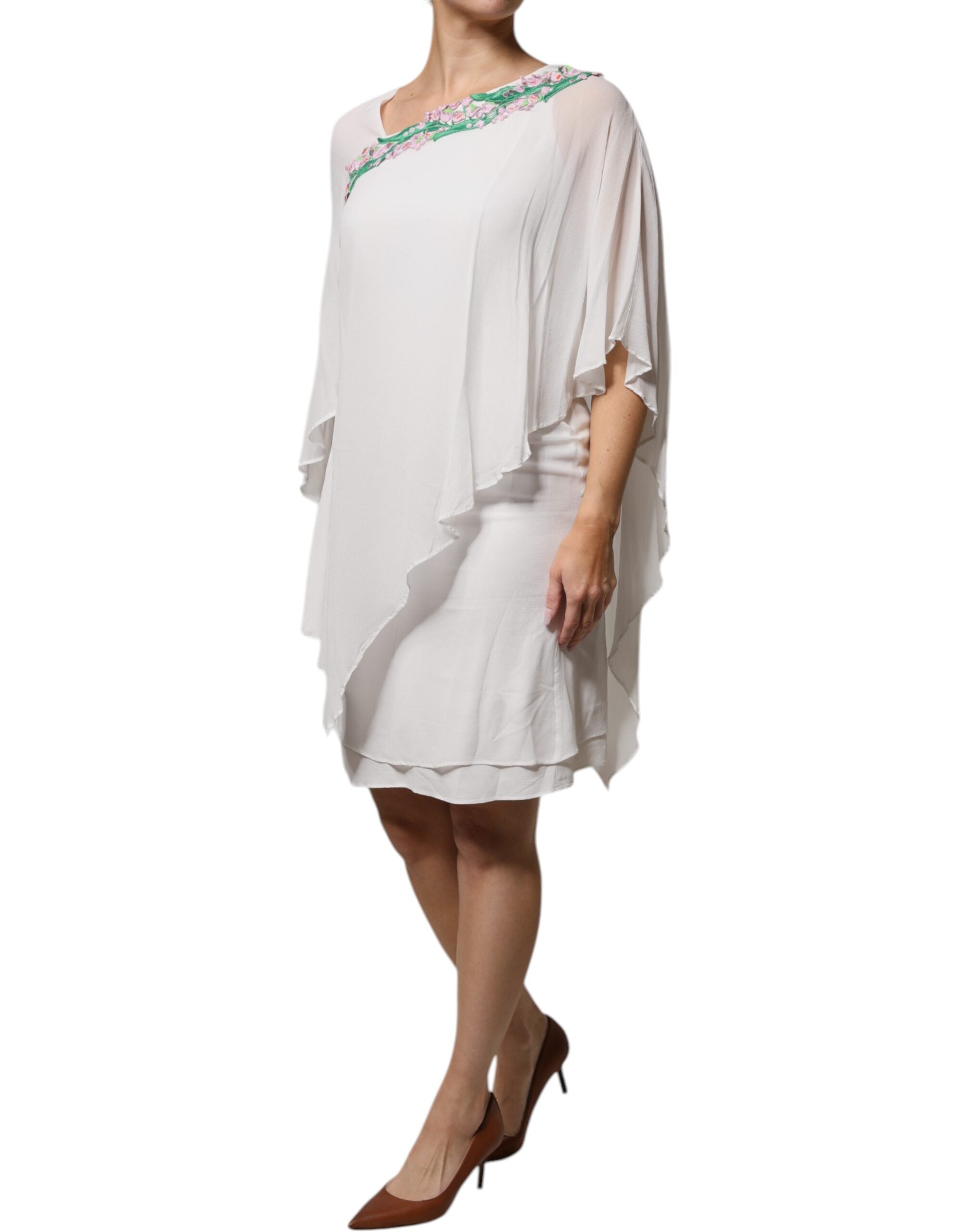 Indulge in the exquisite Blumarine White Floral Embroidery Viscose Chiffon Shift Dress, a timeless masterpiece of luxury and artisanal craftsmanship, perfect for any elegant occasion.