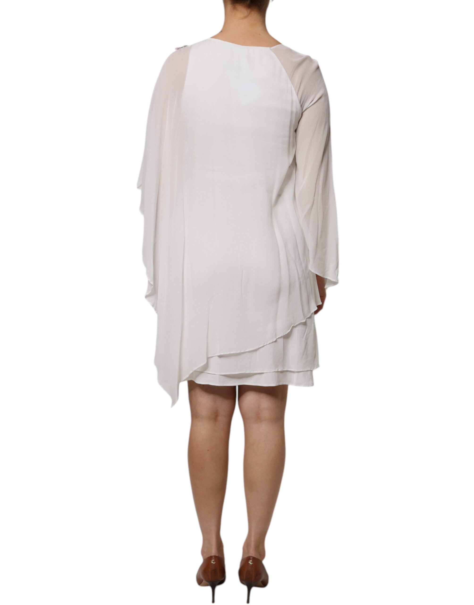 Indulge in the exquisite Blumarine White Floral Embroidery Viscose Chiffon Shift Dress, a masterpiece of Italian craftsmanship that embodies timeless elegance and sophistication.