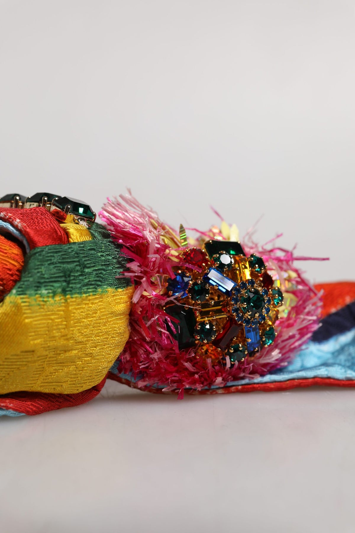 Experience the exquisite Dolce & Gabbana Multicolor Floral Crystal Embellished Diadem Headband, a handcrafted masterpiece that embodies artisanal luxury and timeless elegance.
