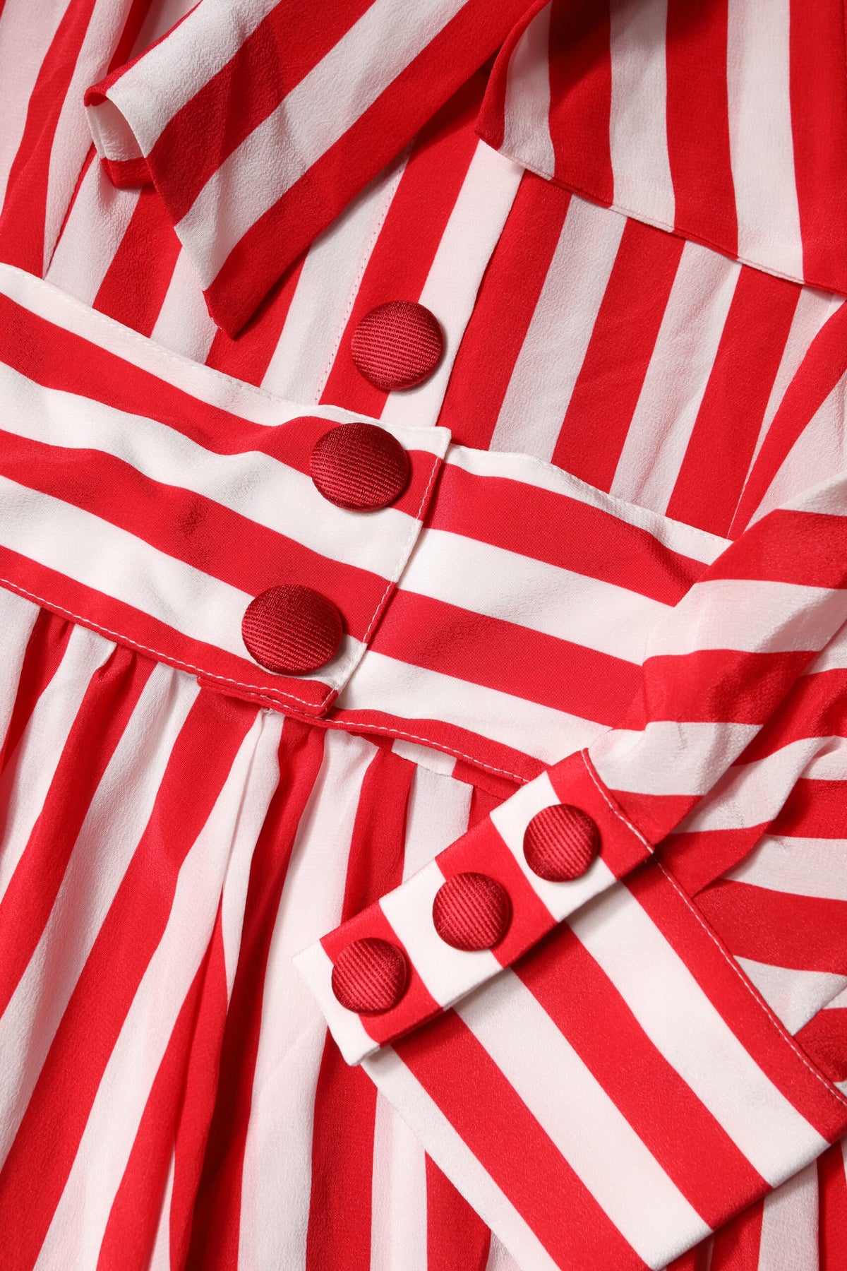 Elevate your wardrobe with the Dolce & Gabbana White Red Stripes Long Sleeves Midi Dress, a silk masterpiece that embodies exquisite craftsmanship and timeless elegance.