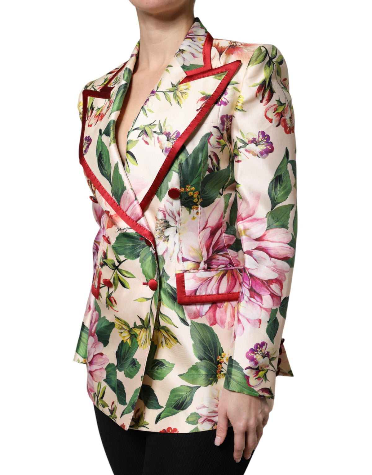 Indulge in the Dolce & Gabbana Multicolor Floral Double Breasted Jacket, a masterpiece of silk craftsmanship that elevates your style with luxurious elegance and timeless allure.