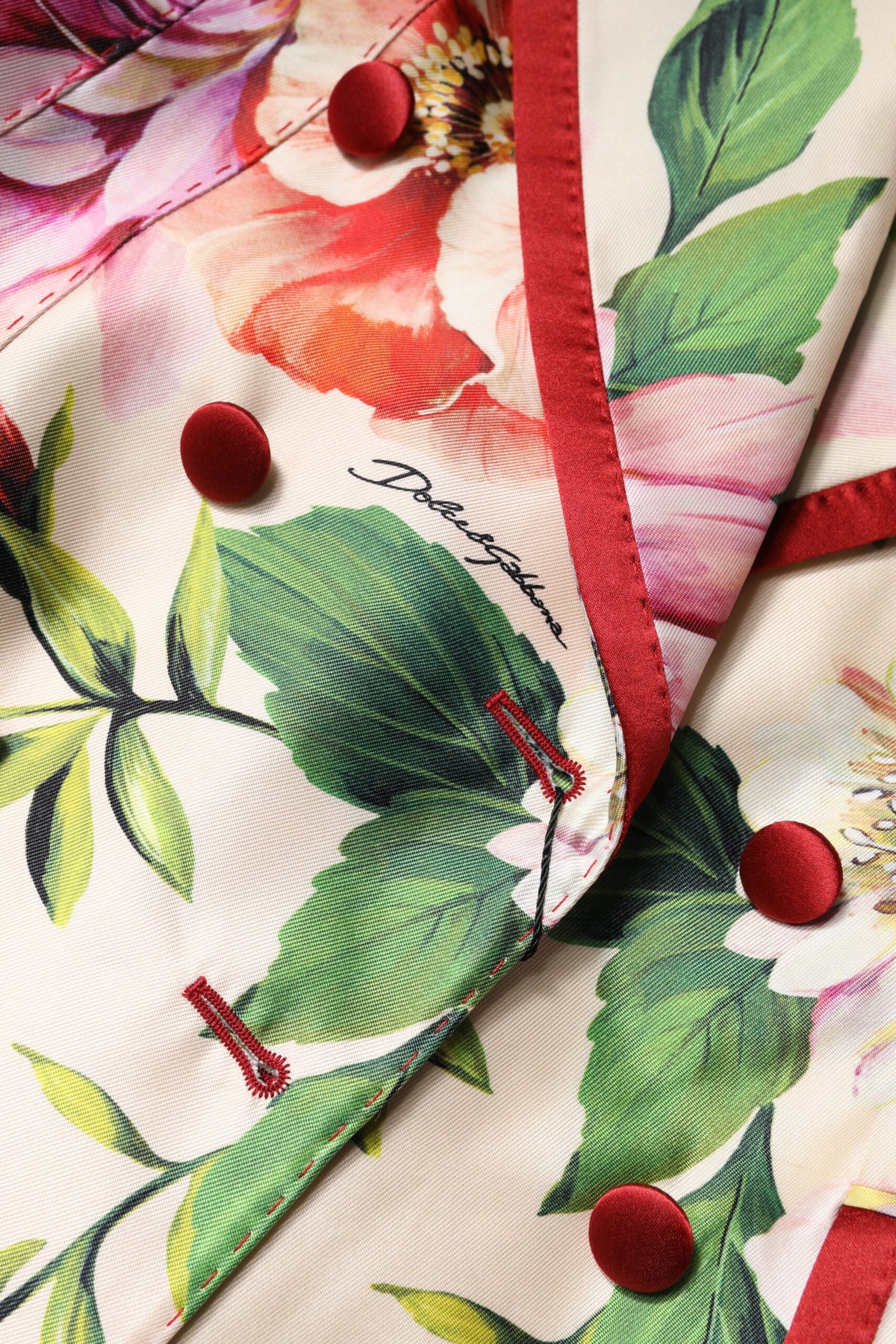 Elevate your wardrobe with the Dolce & Gabbana Multicolor Floral Double Breasted Jacket, a luxurious silk masterpiece that embodies exquisite Italian craftsmanship and timeless sophistication.