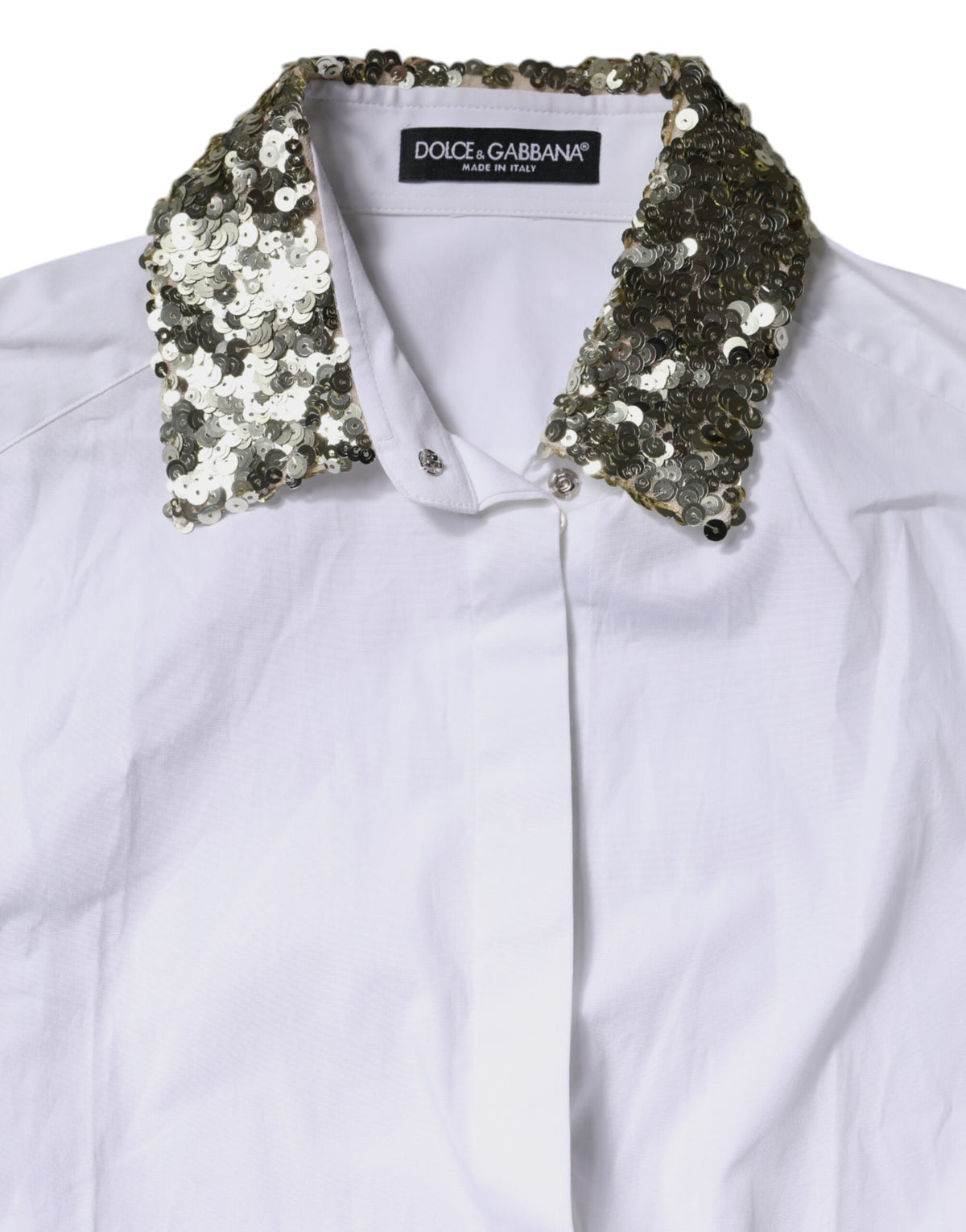 Indulge in the exquisite Dolce & Gabbana White Cotton Long Sleeves Sequin Shirt Top, where luxurious craftsmanship meets timeless elegance, perfect for any sophisticated occasion.