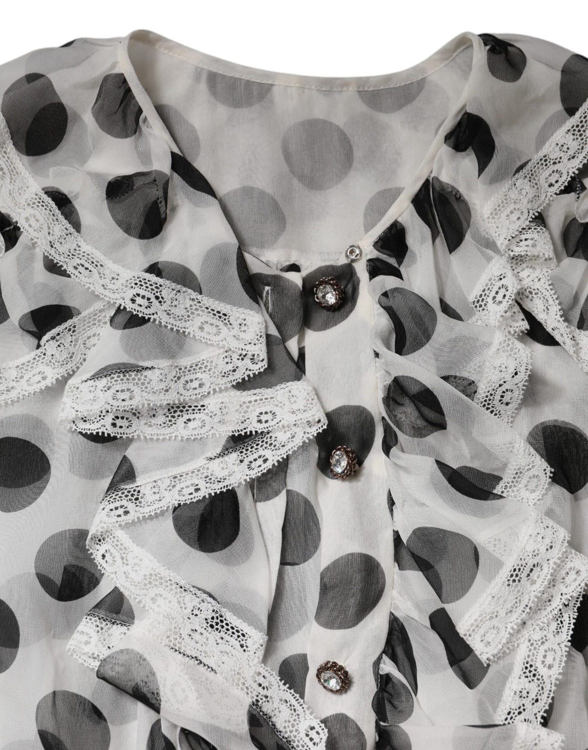 Discover the exquisite Dolce & Gabbana White Black Polka Dot Cotton Sleeveless Top, a timeless blend of silk and cotton, embodying luxury and elegance for the discerning individual.