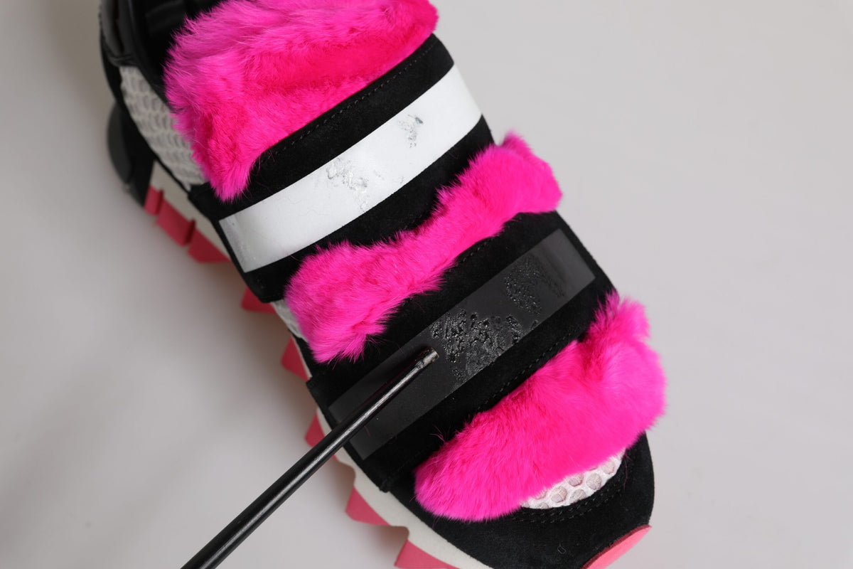 Indulge in the exquisite Dolce & Gabbana Black Pink Fur Embellished Sneakers, where luxurious calf leather meets artisanal craftsmanship for a statement of elegance and sophistication.