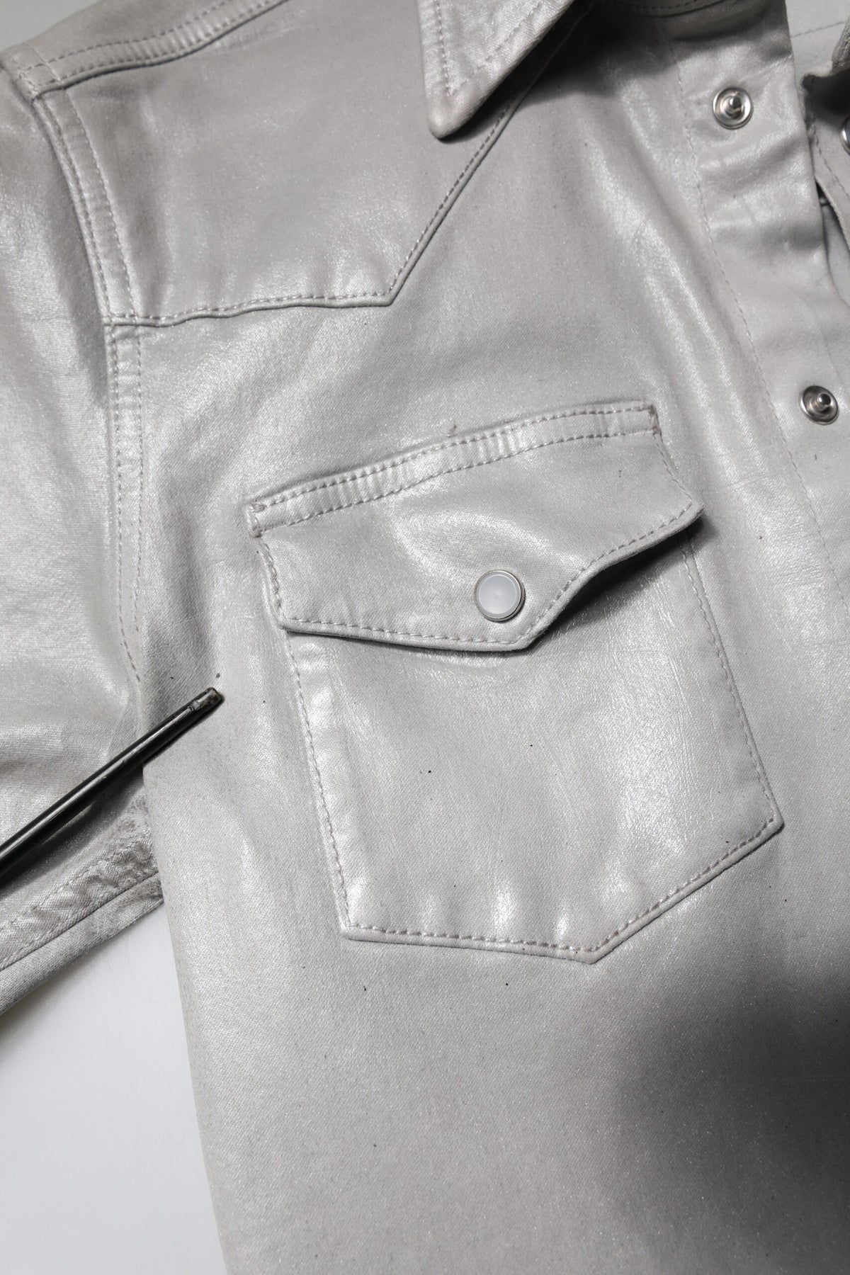 Elevate your wardrobe with the Dolce & Gabbana Metallic Gray Cotton Button Down Shirt, a masterpiece of Italian craftsmanship that embodies timeless elegance and sophisticated allure.