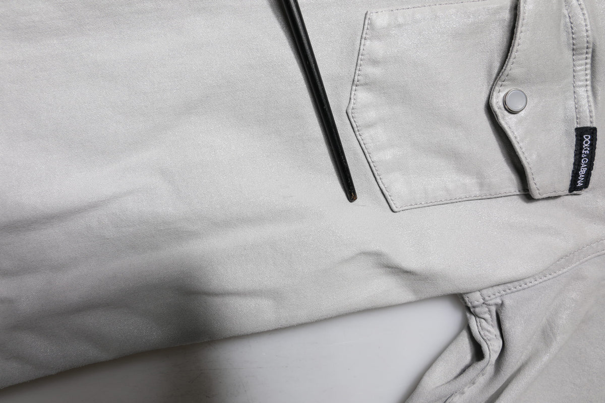 Elevate your wardrobe with the Dolce & Gabbana Metallic Gray Cotton Button Down Shirt, a masterpiece of Italian craftsmanship that embodies sophistication and allure.