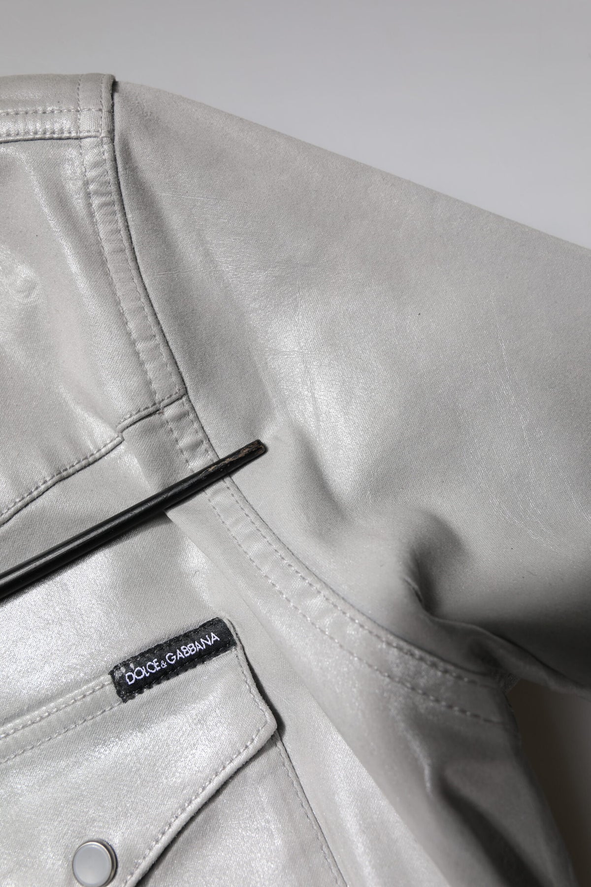 Discover the Dolce & Gabbana Metallic Gray Cotton Button Down Shirt, a timeless blend of Italian craftsmanship and luxurious comfort, perfect for any sophisticated occasion.