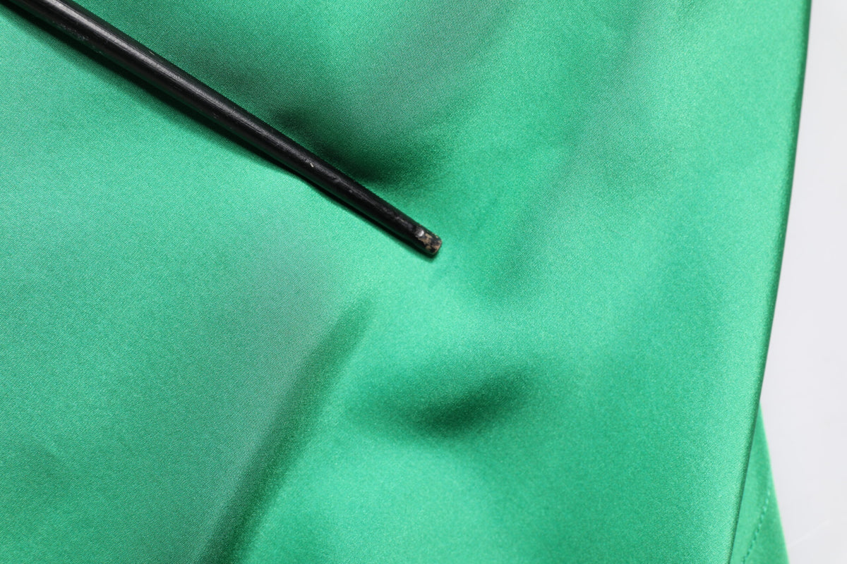 Indulge in the exquisite allure of Dolce & Gabbana's Green Silk Satin Long Sleeves Casual Shirt, a masterpiece of Italian craftsmanship that embodies timeless luxury and sophisticated elegance.