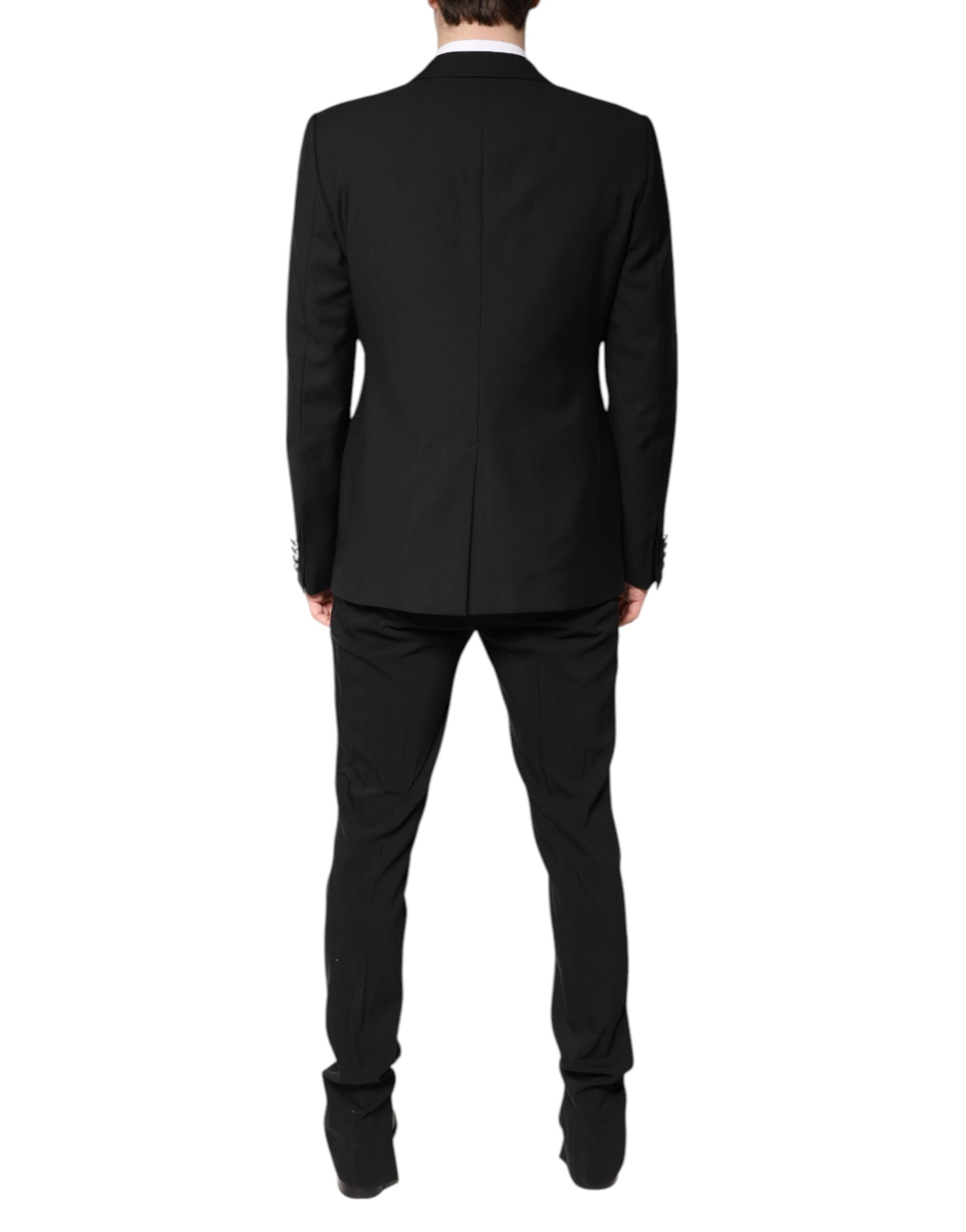 Experience the opulent elegance of the Dolce & Gabbana Black Wool Single Breasted Suit, a timeless blend of luxurious materials and exquisite Italian craftsmanship, perfect for discerning tastes.