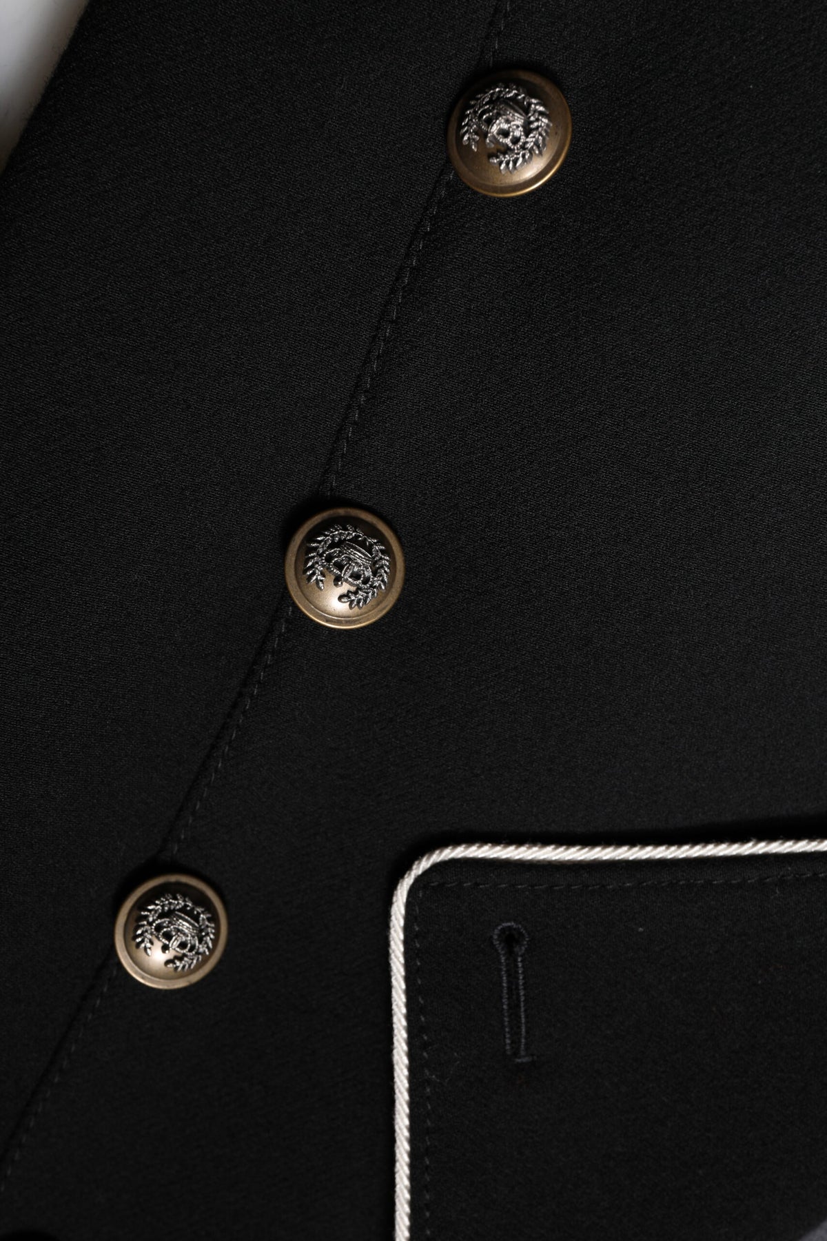 Discover the exquisite Dolce & Gabbana Black Wool Double Breasted Blazer, a timeless masterpiece crafted from premium materials, embodying elegance and sophistication for the discerning individual.