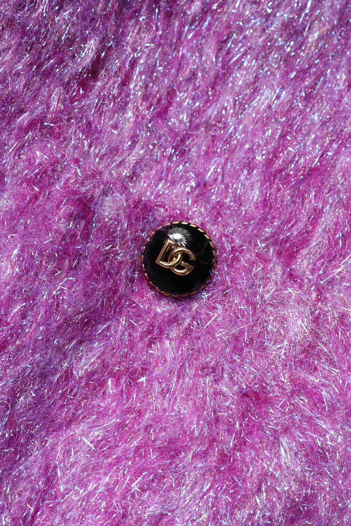 Experience the exquisite Dolce & Gabbana Purple Button Embellished Trench Coat, a luxurious blend of wool and mohair, embodying timeless elegance and sophisticated allure.