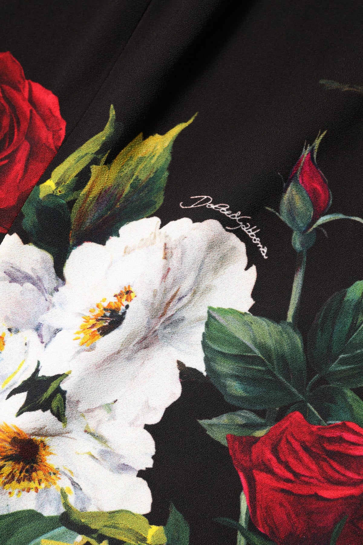 Indulge in the exquisite allure of the Dolce & Gabbana Black Floral Print Sleeveless Sheath Dress, where luxurious fabrics and Italian craftsmanship redefine elegance for any occasion.