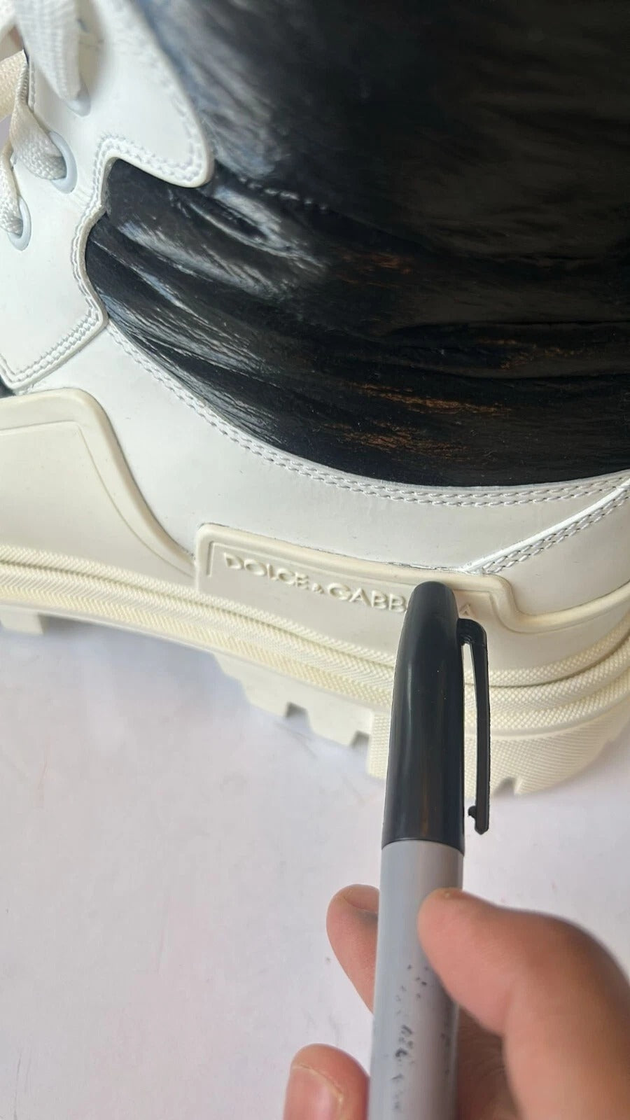 Experience the allure of Dolce & Gabbana's White Padded Mid Calf Lace Up Boots, crafted in Italy from luxurious materials, embodying sophistication and timeless elegance.