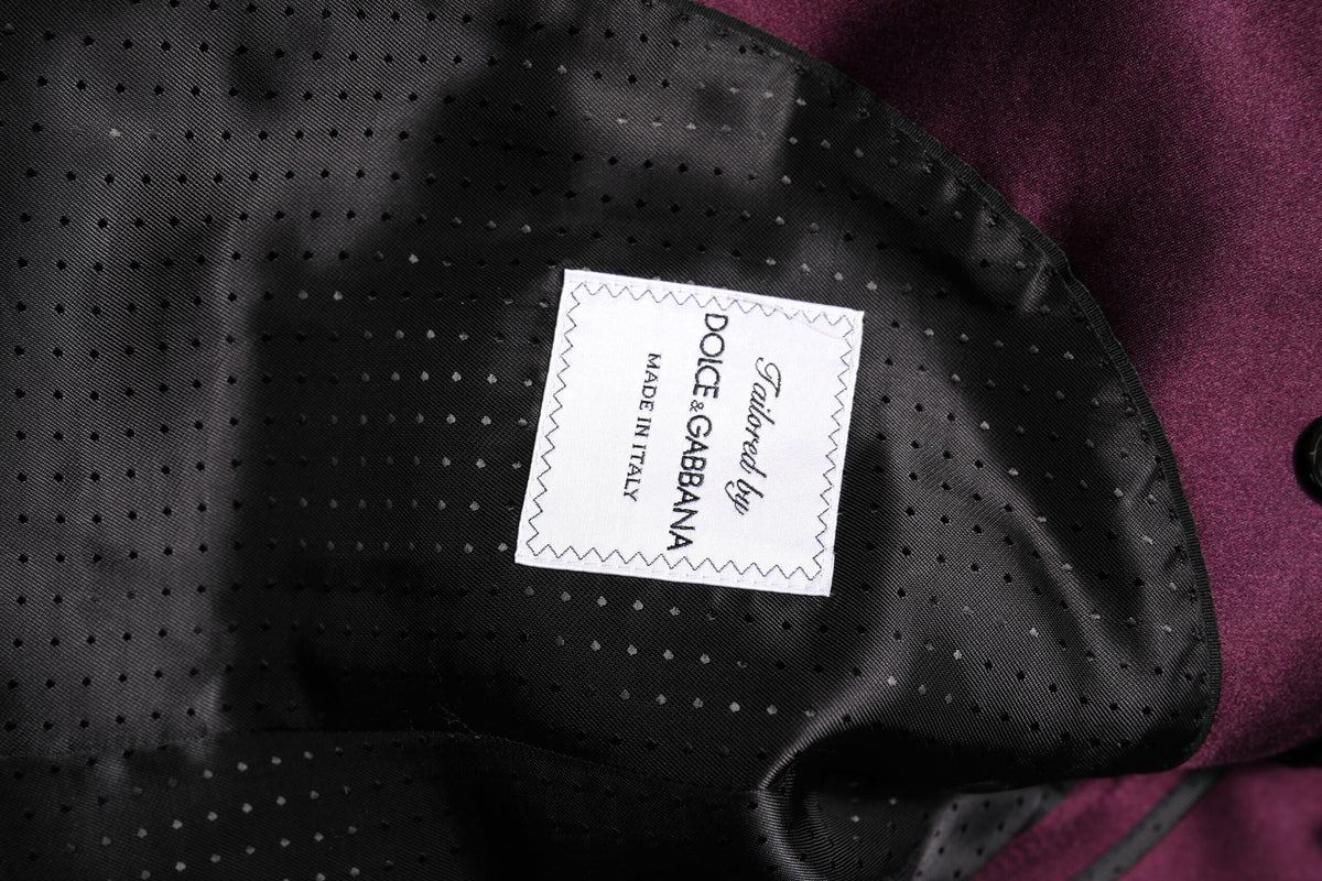 Indulge in the exquisite Dolce & Gabbana Dark Purple Silk 3Piece Suit, where luxurious silk meets impeccable Italian craftsmanship, perfect for the discerning individual.
