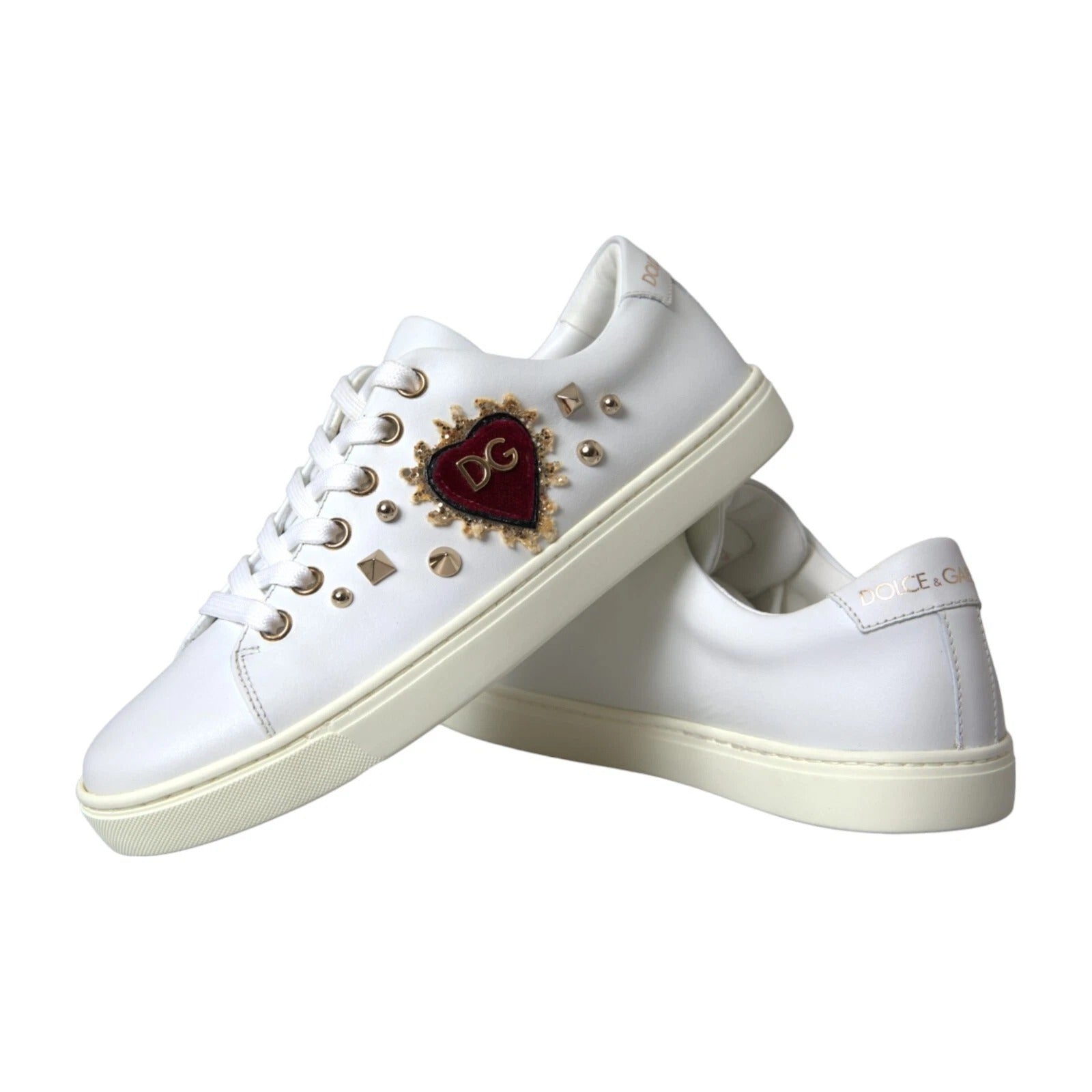 Step into the allure of Dolce & Gabbana's Portofino Sneakers, crafted from luxurious calf leather, adorned with exquisite heart details for an elevated expression of elegance.