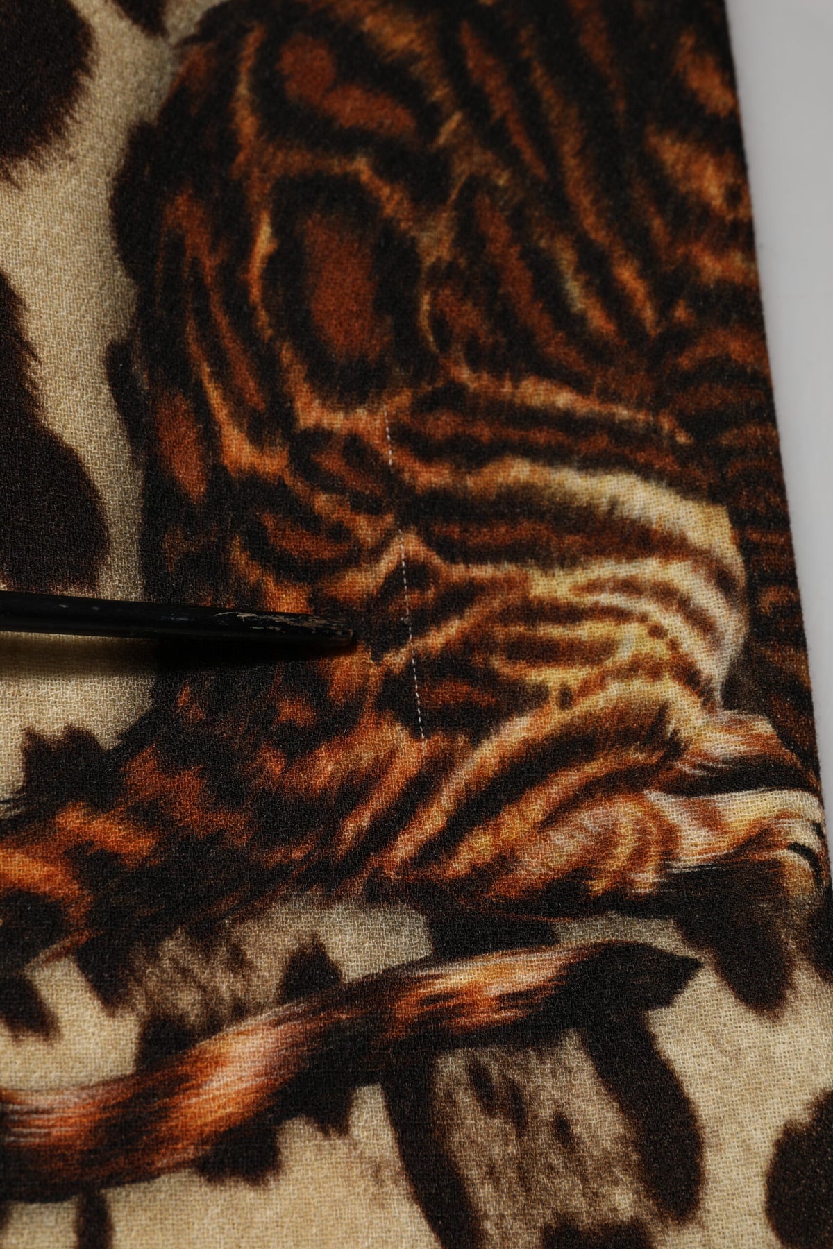 Elevate your wardrobe with the Dolce & Gabbana Brown Leopard Print Belted A-line Midi Dress, a luxurious blend of virgin wool and nylon, embodying Italian craftsmanship and timeless elegance.