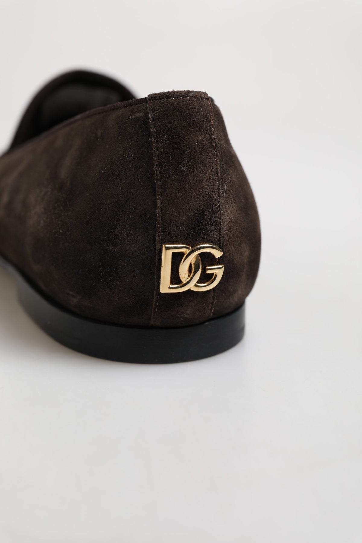 Indulge in the exquisite Dolce & Gabbana Brown Velvet Leather Slip On Loafers, a timeless symbol of elegance crafted in Italy for those who embrace luxury and sophistication.