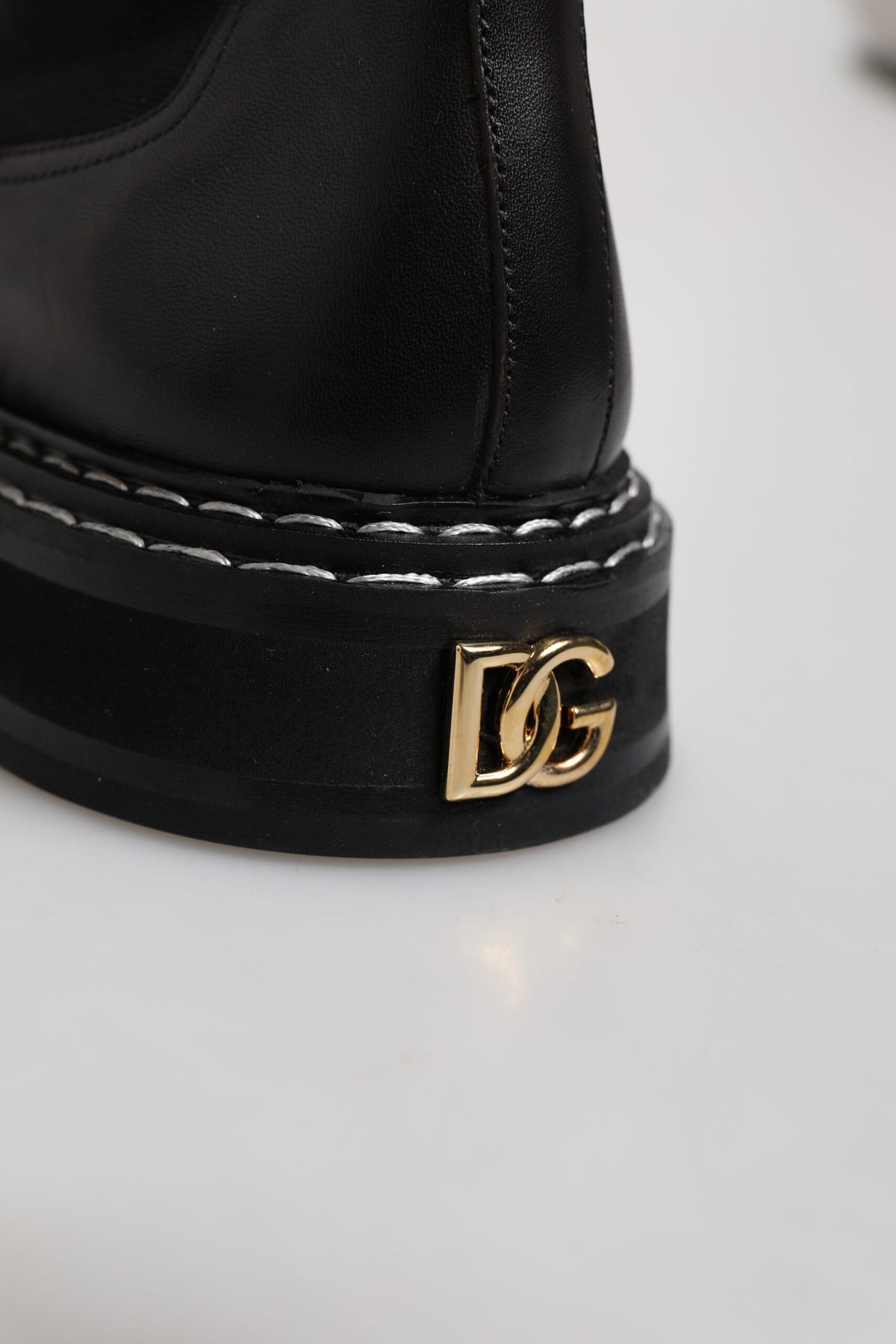 Step into the realm of luxury with Dolce & Gabbana's Black Leather Mid Calf Boots, where exquisite calf leather meets timeless elegance, embodying refined sophistication for the discerning individual.