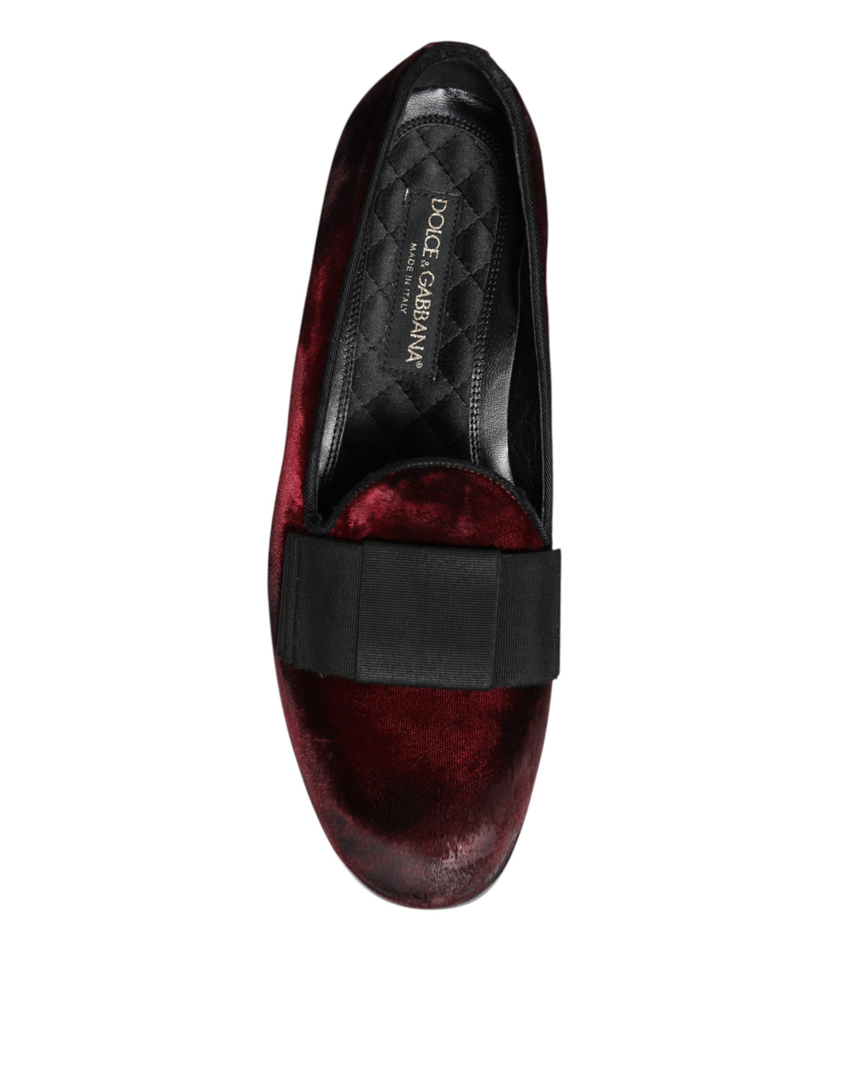 Step into timeless elegance with Dolce & Gabbana Red Velvet Men Slip On Loafers, crafted in Italy from luxurious leather, embodying sophistication and allure for the discerning individual.
