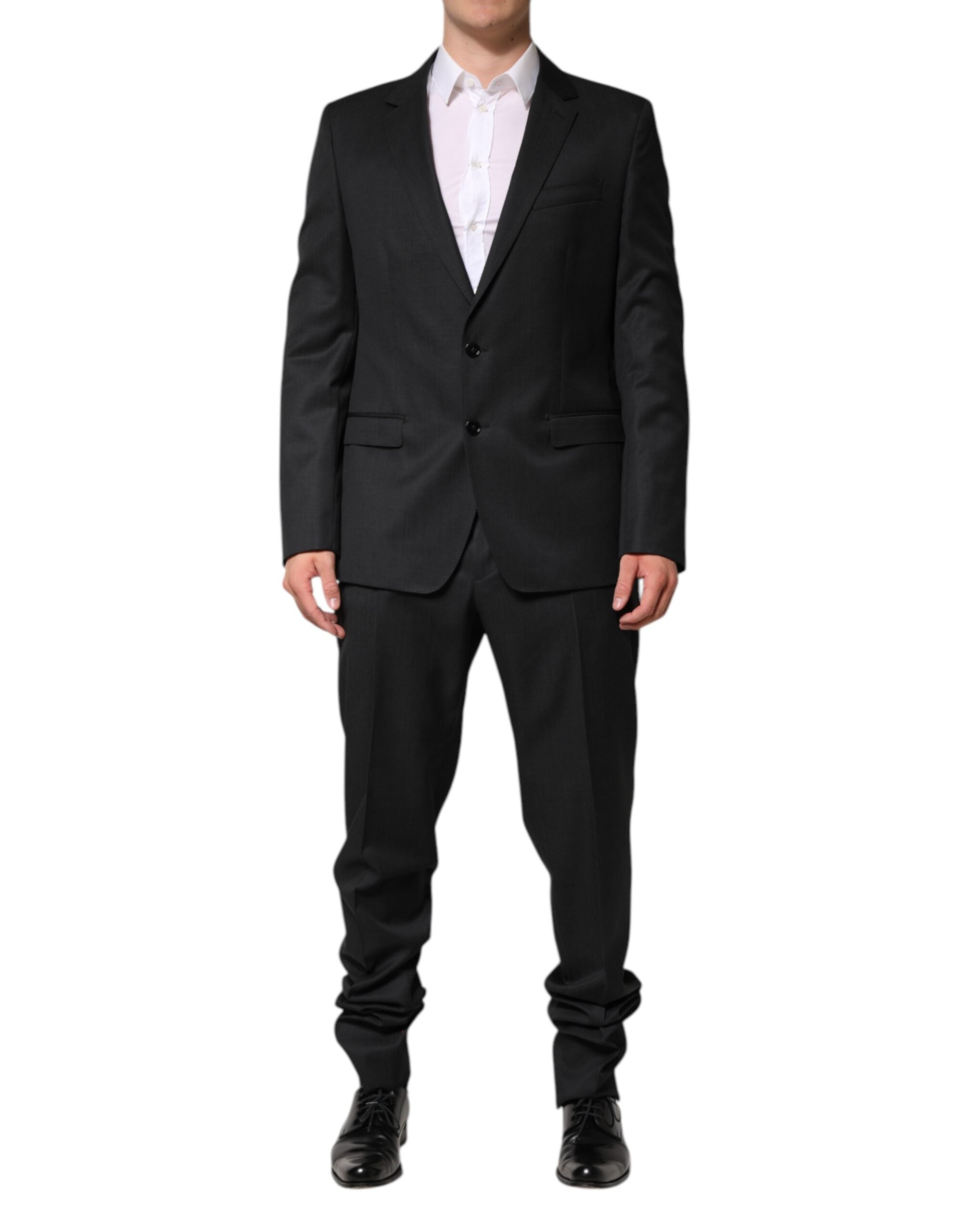 Elevate your elegance with the Dolce & Gabbana Dark Gray Wool Suit, a masterpiece of Italian craftsmanship in 100% virgin wool, designed for the discerning individual.