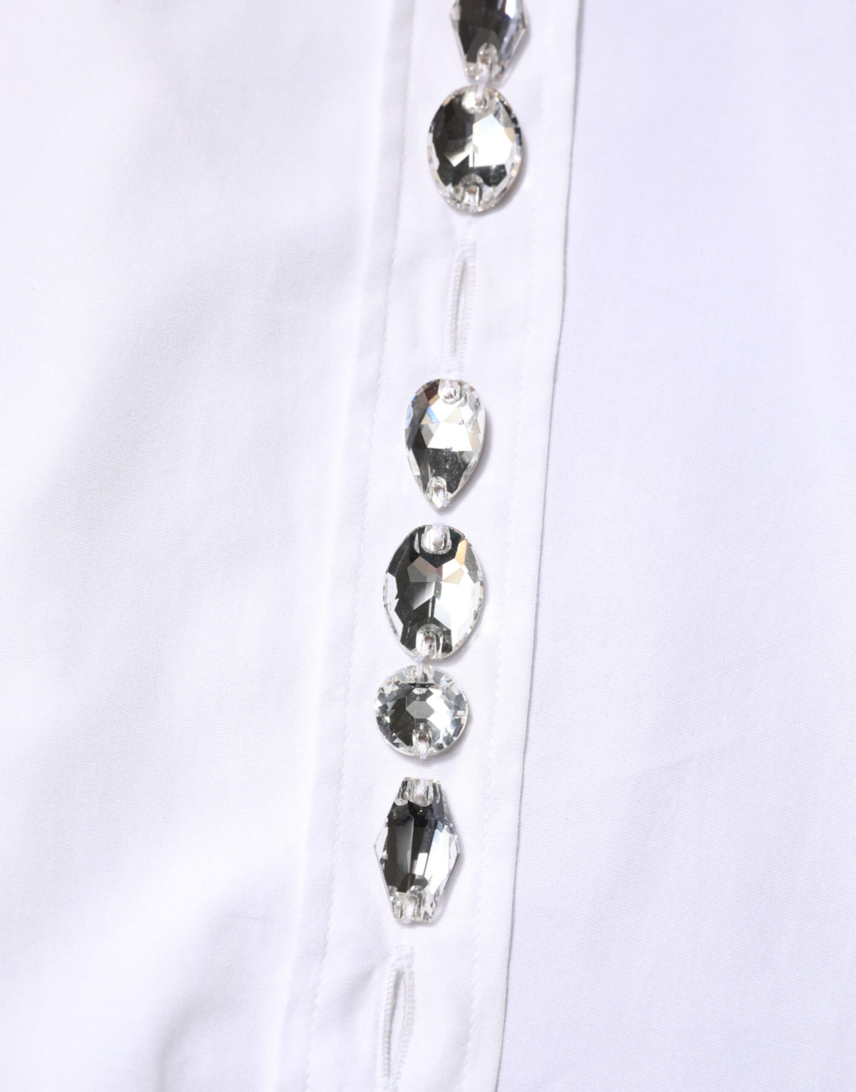 Elevate your wardrobe with the Dolce & Gabbana White Crystal Embellished Collared Shirt Top, a masterpiece of Italian craftsmanship in luxurious cotton, perfect for any sophisticated occasion.