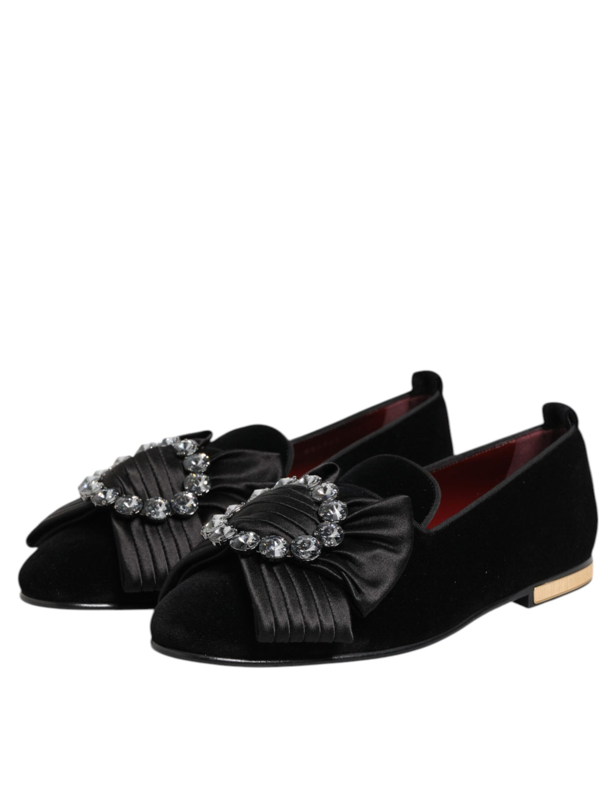 Step into unparalleled elegance with Dolce & Gabbana's Black VATICANO Crystal Ribbon Slip On Shoes, crafted from premium materials and designed for the discerning individual.