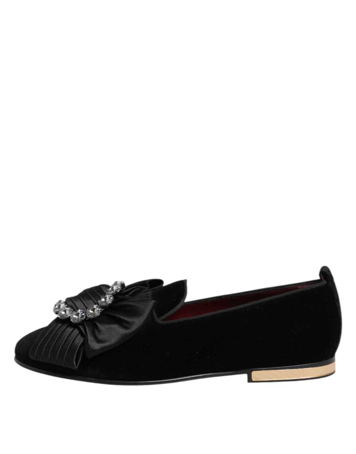 Step into opulence with Dolce & Gabbana's VATICANO Crystal Ribbon Slip On Shoes, crafted in Italy from premium materials, embodying timeless elegance and luxurious artistry.