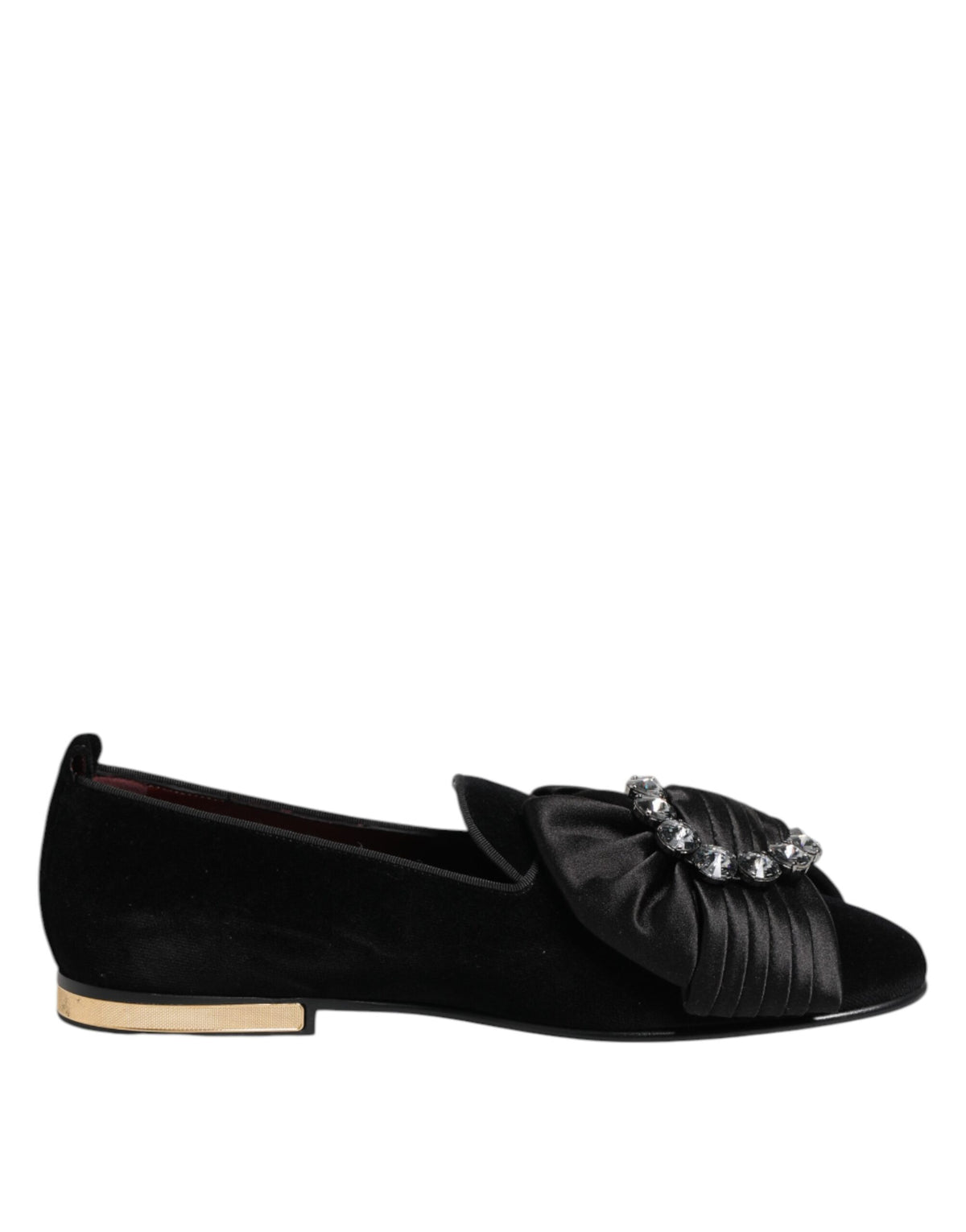 Elevate your style with Dolce & Gabbana's Black VATICANO Crystal Ribbon Slip On Shoes, where exquisite craftsmanship meets luxurious materials for timeless elegance.