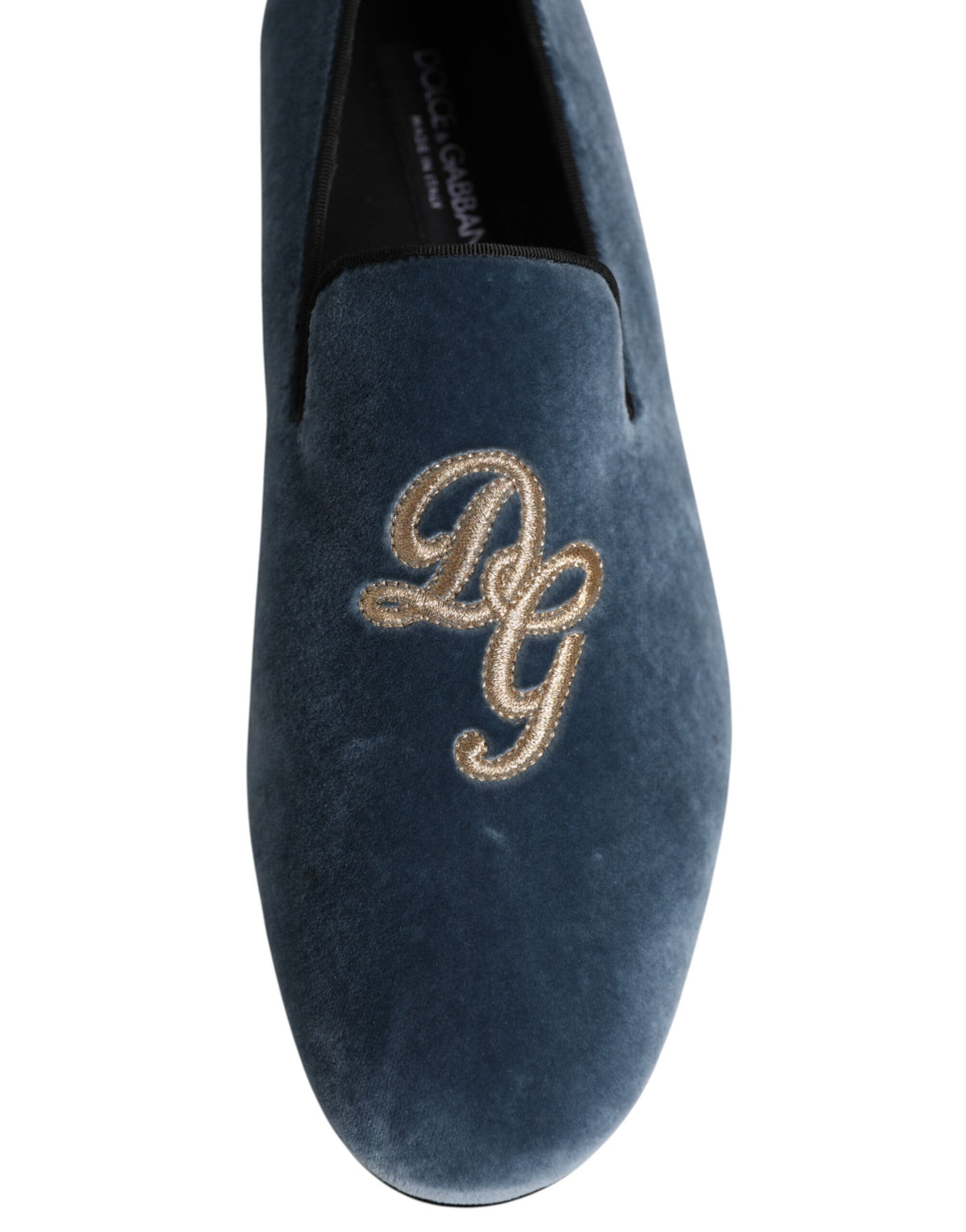 Indulge in the exquisite Dolce & Gabbana Blue Velvet DG Logo Loafers, where sumptuous materials and Italian craftsmanship elevate your style to unparalleled luxury.