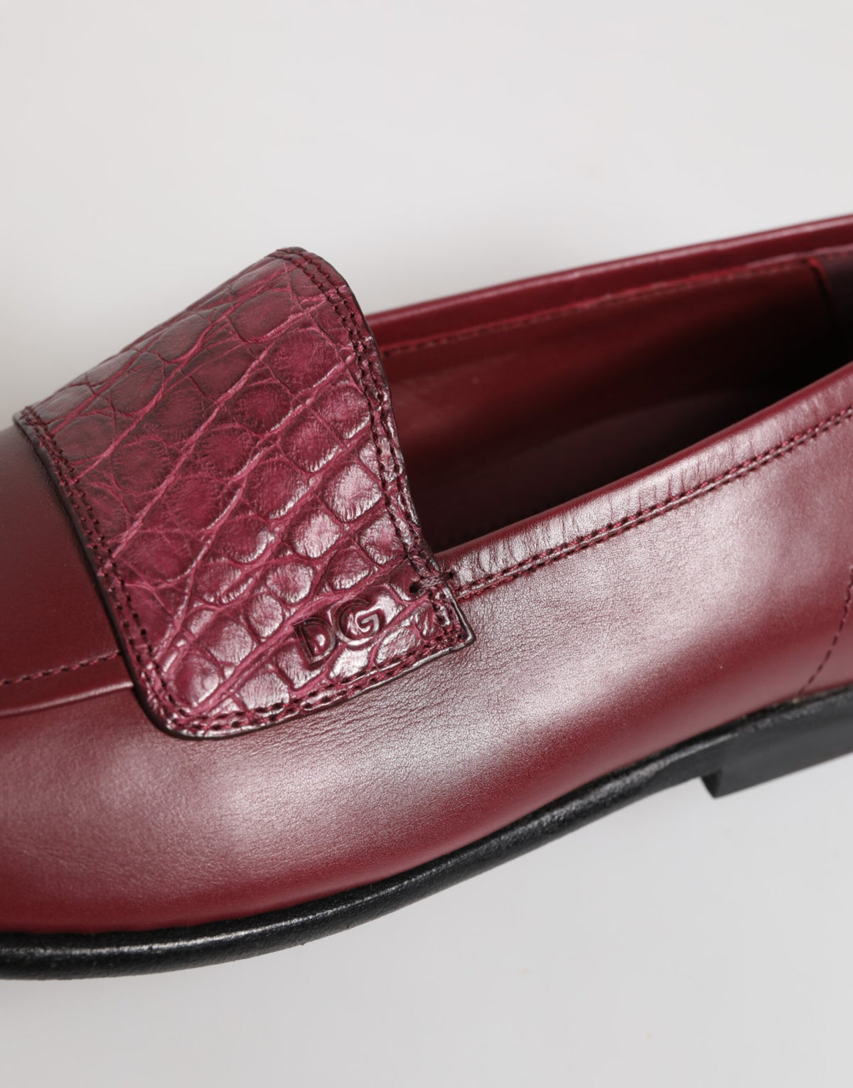 Indulge in the exquisite craftsmanship of Dolce & Gabbana's Burgundy Leather Formal Slip On Shoes, where luxurious materials meet timeless elegance for the discerning individual.