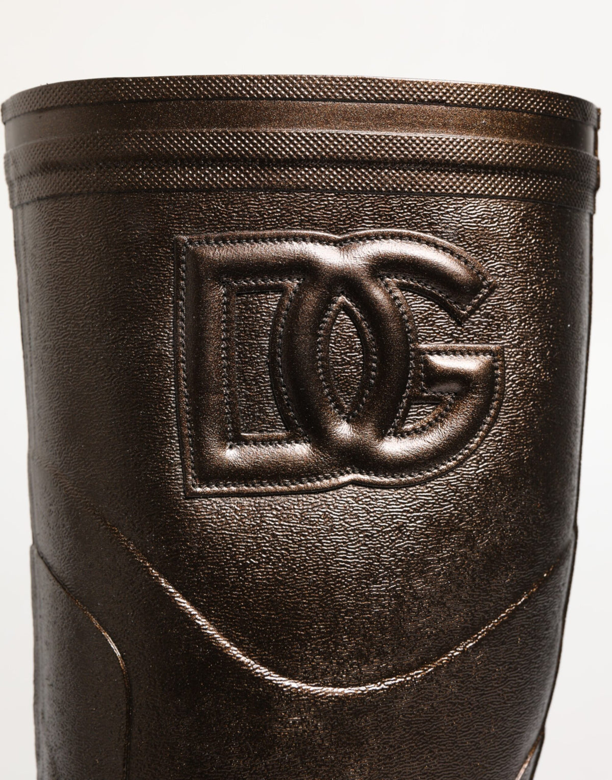 Elevate your style with Dolce & Gabbana's Metallic Bronze Pull On Rain Boots, where exquisite Italian craftsmanship meets luxurious functionality for the discerning individual.