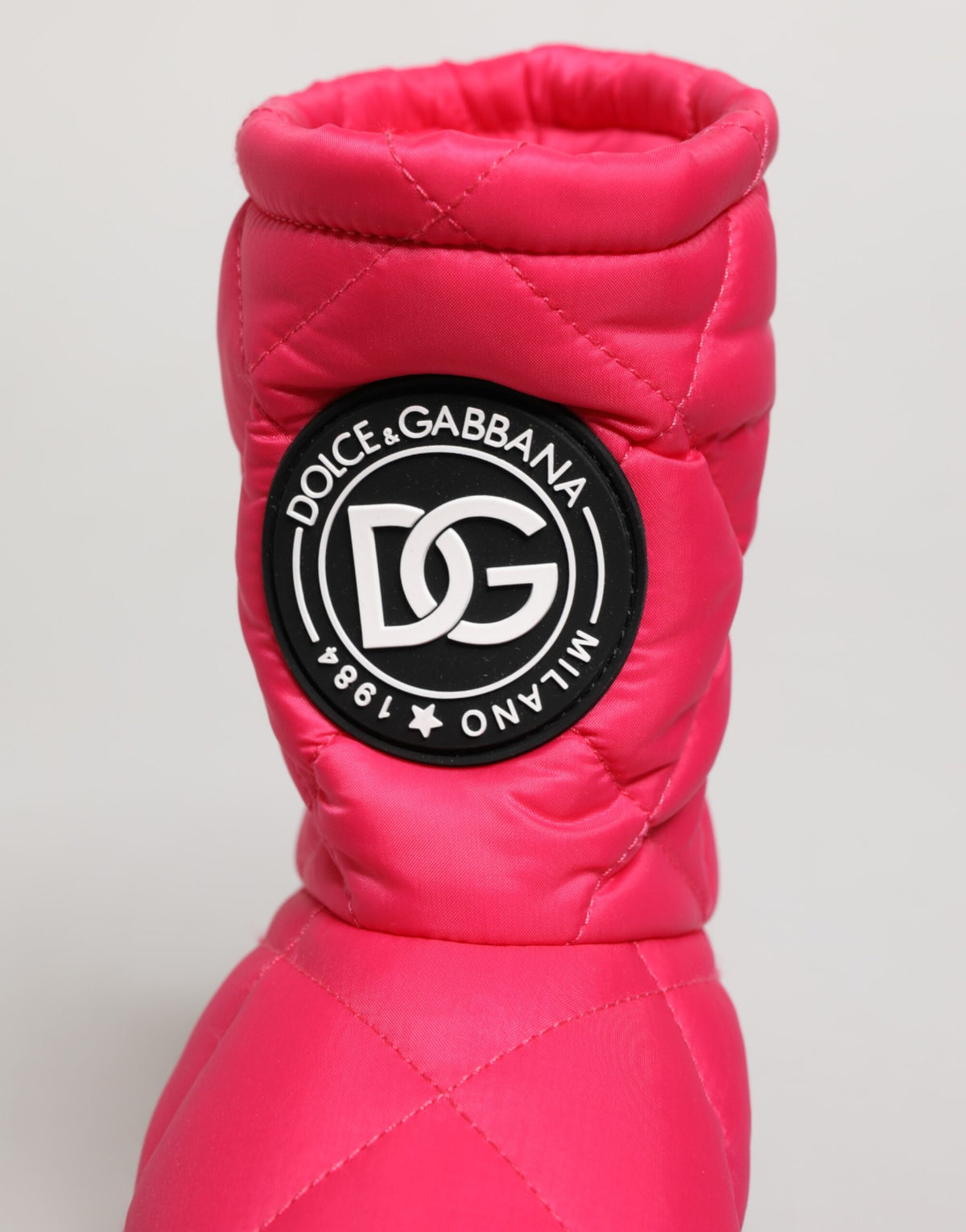 Elevate your style with Dolce & Gabbana Pink White Viscose Padded Mid Calf Boots, where luxurious craftsmanship meets bold elegance, perfect for the discerning modern muse.
