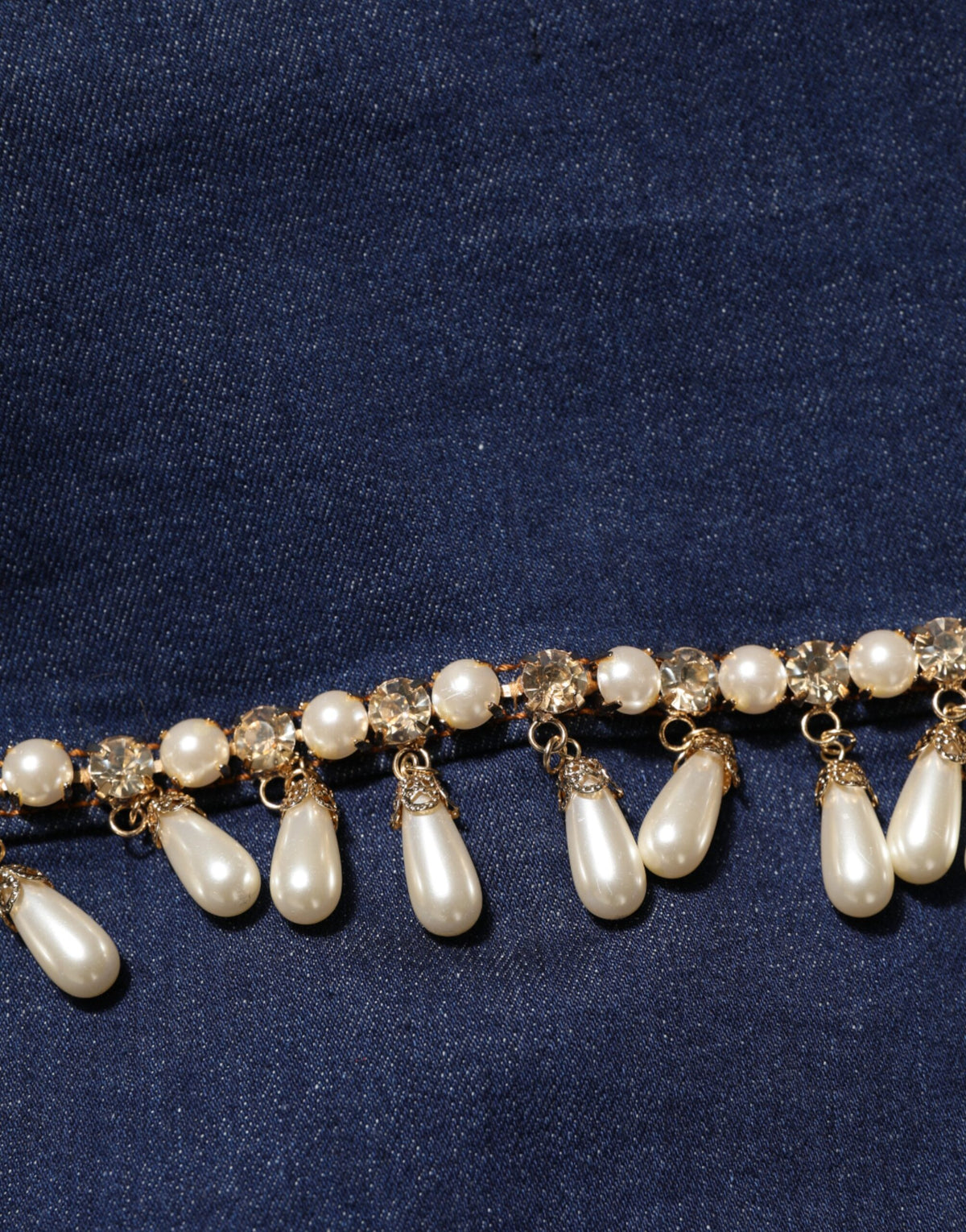 Indulge in the exquisite Dolce & Gabbana Blue Cotton Denim Crystal Embellished Jacket, where luxurious craftsmanship meets timeless elegance, perfect for the discerning individual.