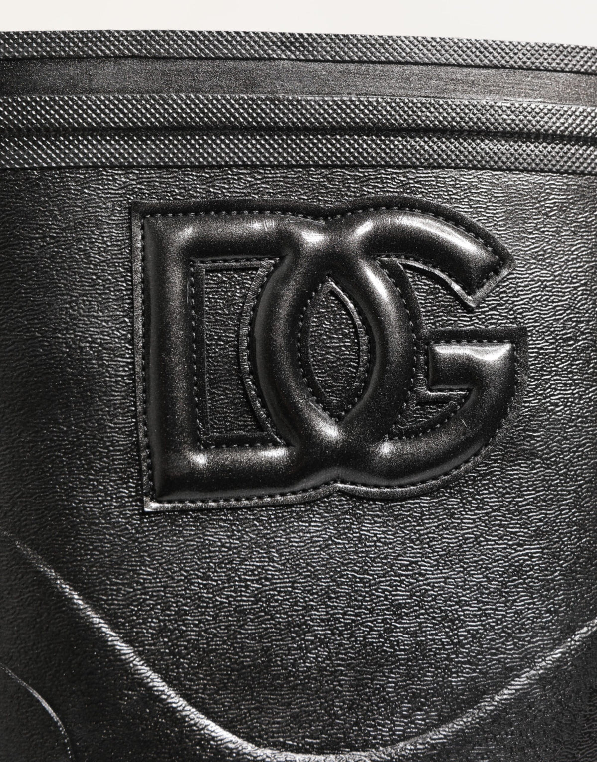 Indulge in the exquisite Dolce & Gabbana Metallic Black Pull On Rain Boots, where luxurious PVC and leather craftsmanship meet sophisticated style for the discerning connoisseur.