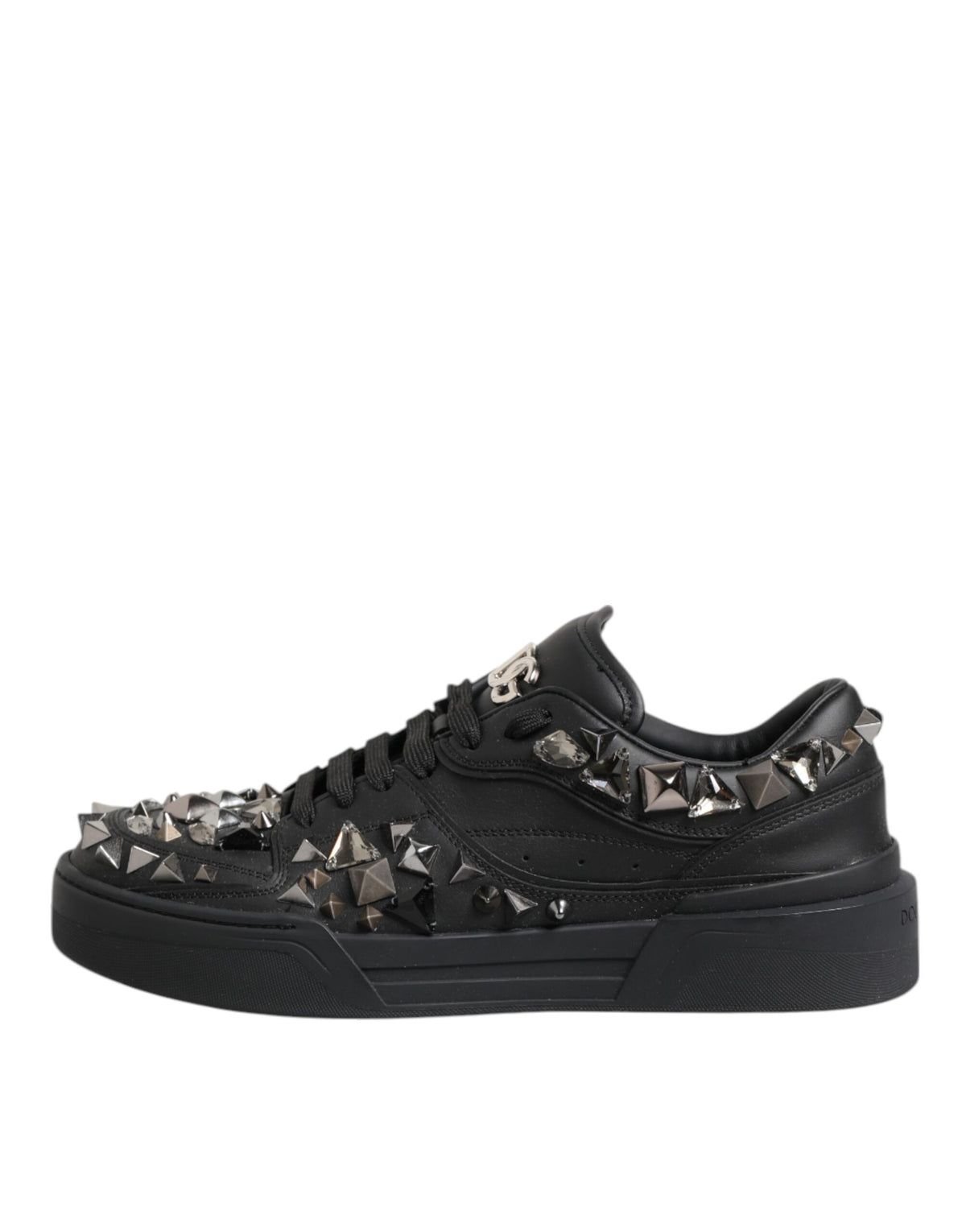 Elevate your style with Dolce & Gabbana's Black Leather Studded Low Top Sneakers, crafted from premium calf leather for unparalleled luxury and sophistication.