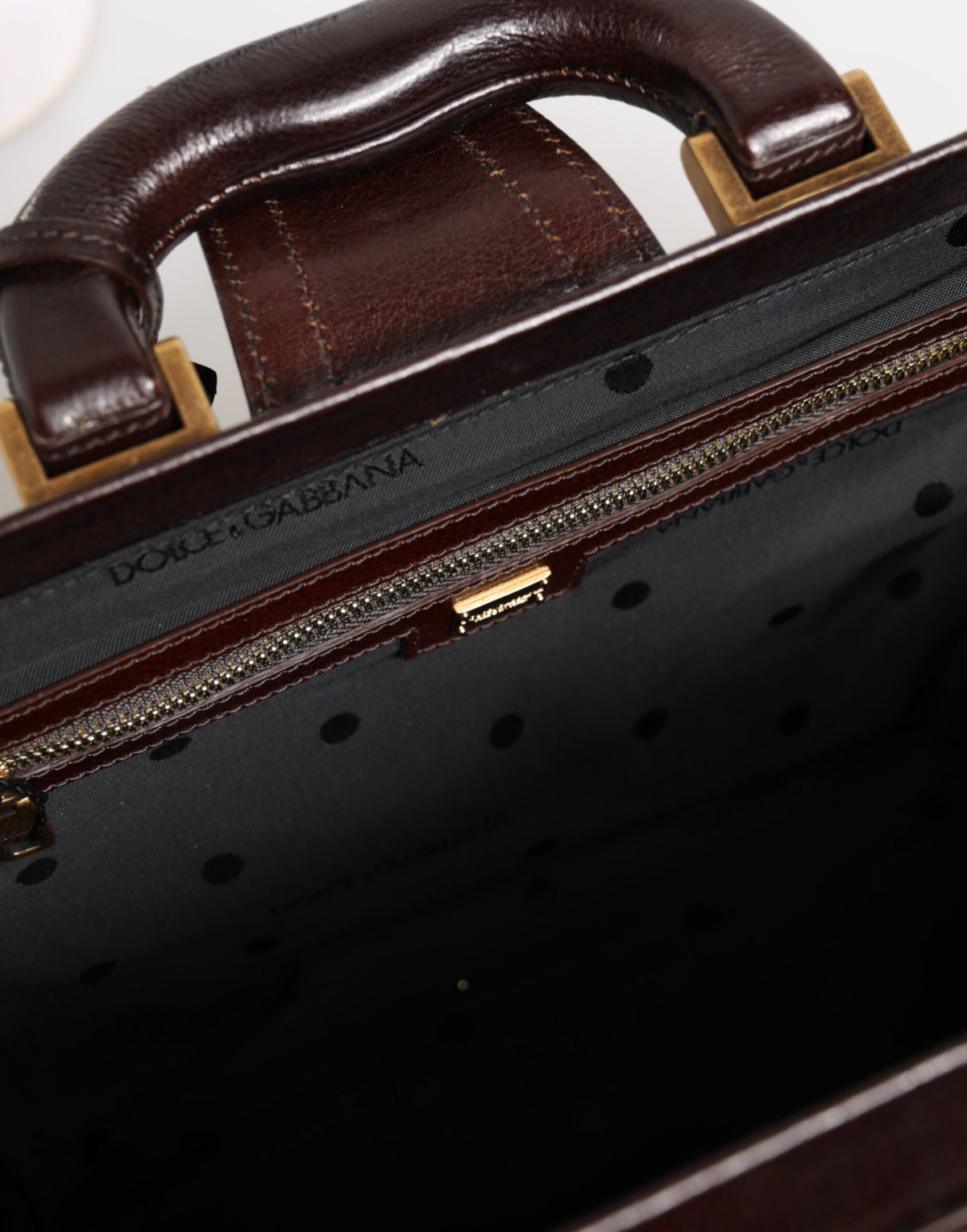 Experience the allure of the Dolce & Gabbana Blue Brown Leather Floral Jacquard Travel Handbag, a masterpiece of Italian craftsmanship that redefines luxury travel.