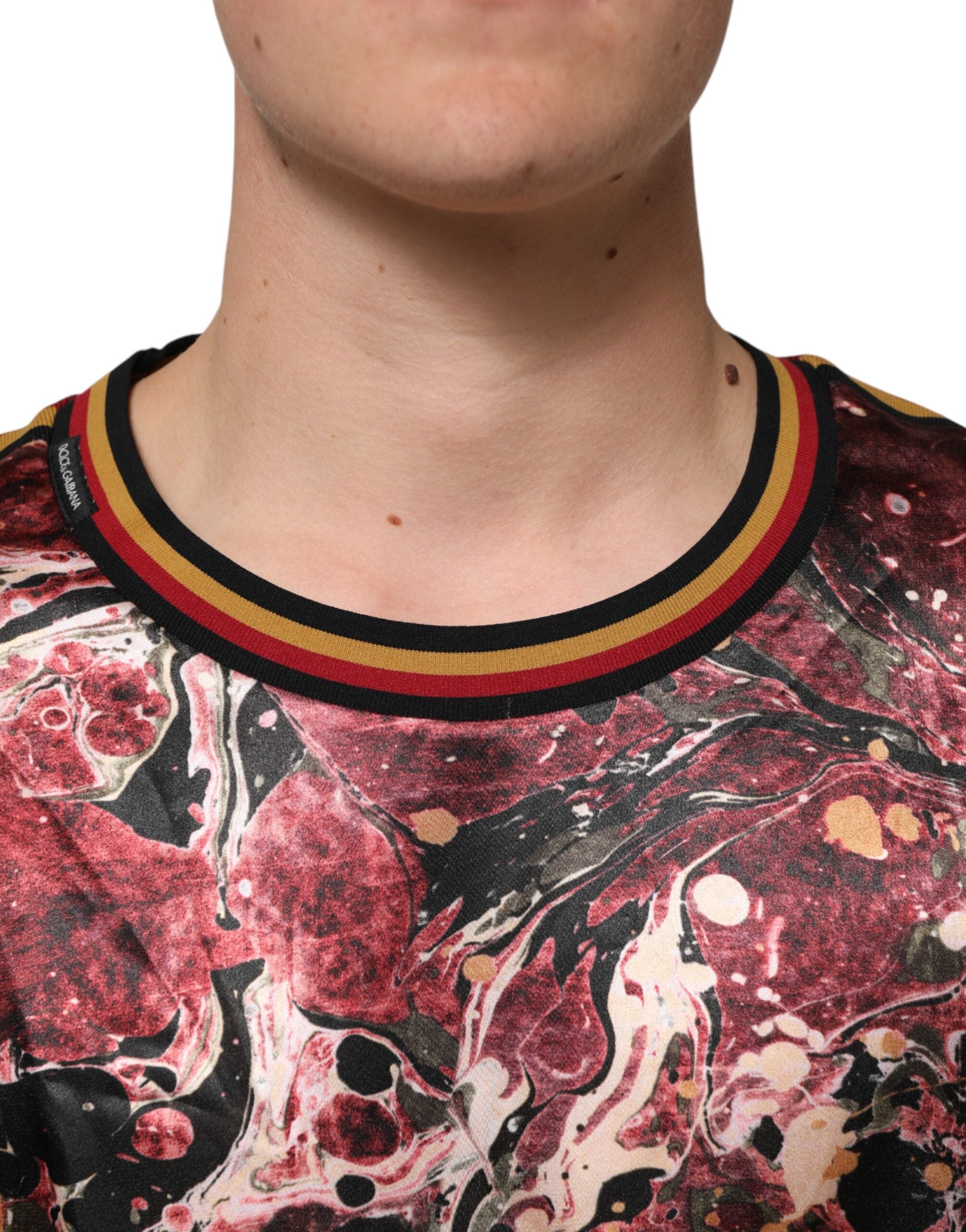 Experience the exquisite artistry of the Dolce & Gabbana Multicolor Polyester Marble Print Oversize T-shirt, where luxurious craftsmanship meets bold design for a statement of individuality.