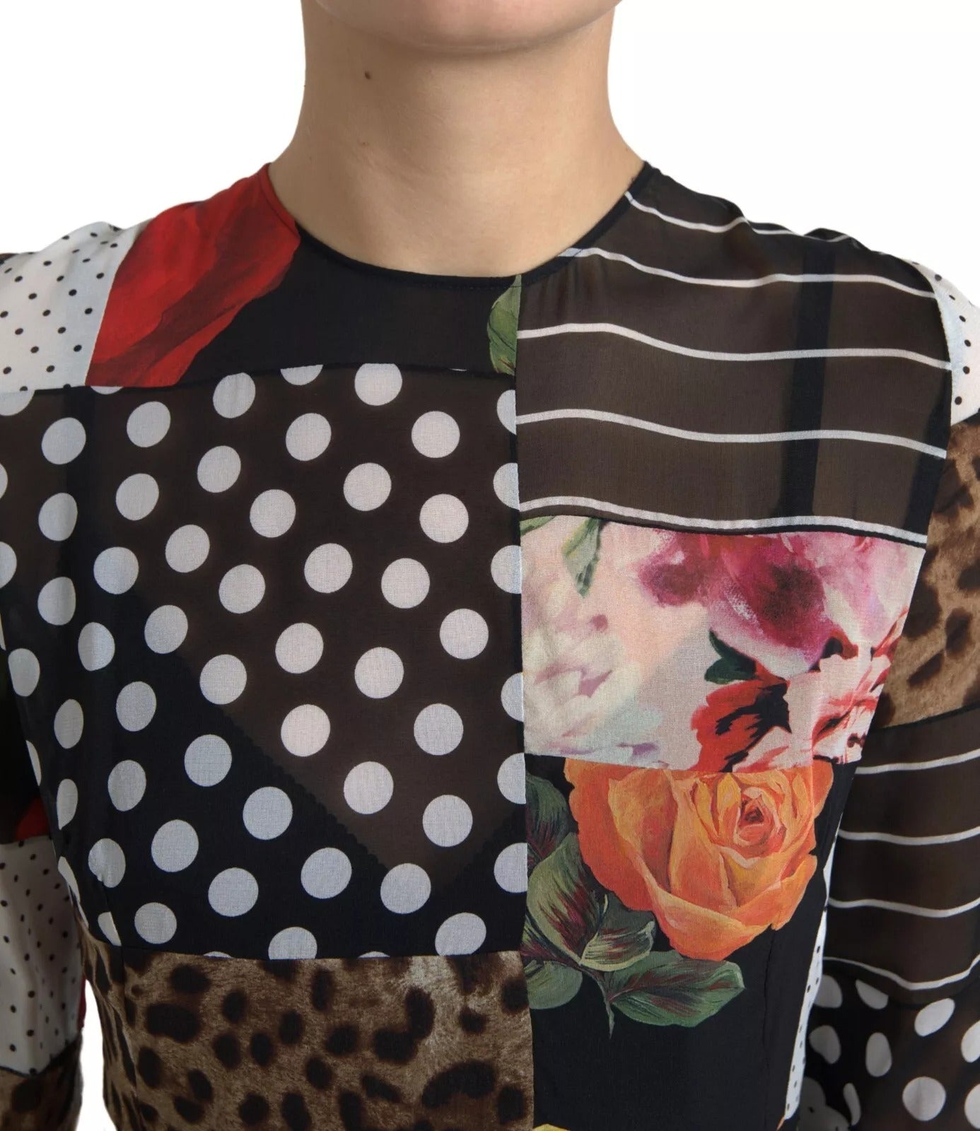 Indulge in the exquisite artistry of the Dolce & Gabbana Multicolor Patchwork Floral Leopard Dress, a luxurious silk blend that embodies Italian craftsmanship and timeless elegance.