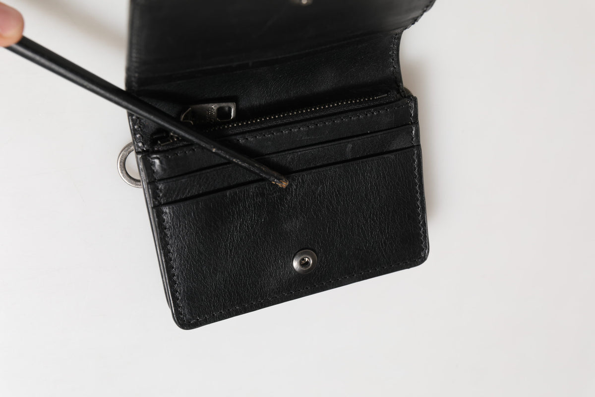 Experience the allure of the Dolce & Gabbana Black Leather Bifold Card Holder, a masterpiece of Italian craftsmanship that embodies luxury and sophistication for the discerning individual.