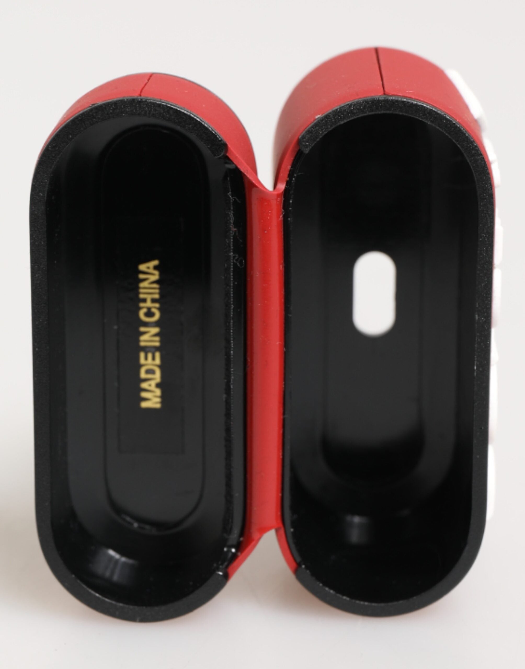 Custodia Airpods in silicone rosso e bianco con logo in rilievo di Dolce &amp; Gabbana