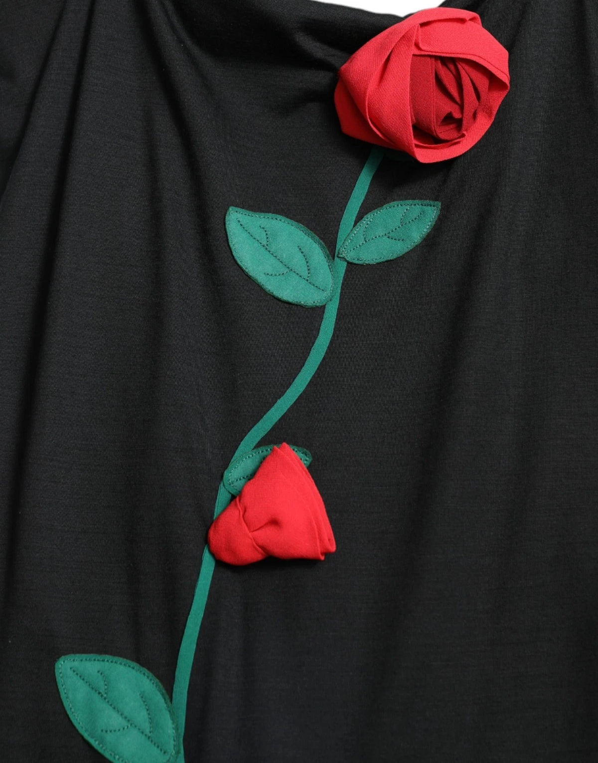 Indulge in the exquisite allure of the Dolce & Gabbana Black Wool Sleeveless Rose Applique Dress, a testament to Italian craftsmanship and timeless elegance, perfect for unforgettable moments.