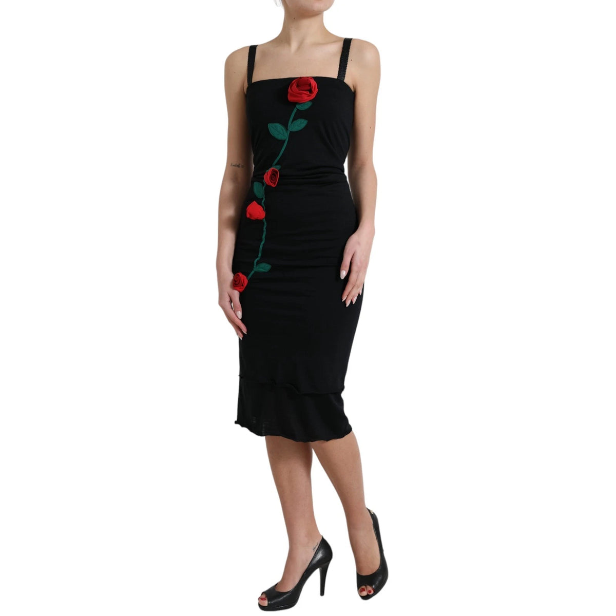 Indulge in the exquisite allure of the Dolce & Gabbana Black Wool Sleeveless Rose Applique Dress, a masterpiece of Italian craftsmanship that redefines elegance for any occasion.